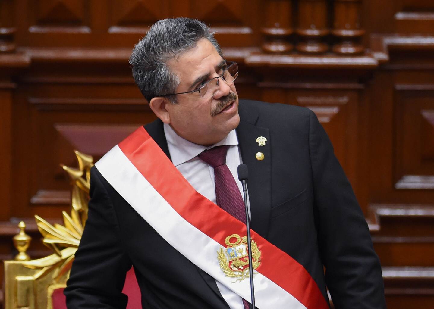 The head of the Peruvian Congress, Manuel Merino, gives an acceptance speech during his investiture ceremony as interim president in Lima on November 10, 2020 a day after the Congress voted to impeach and oust President Martin Vizcarra over corruption allegations. - Merino, 59, was sworn in at a special session of Congress on Tuesday, becoming Peru's third president since 2016, reflecting the institutional fragility which has characterized the South American country. Under the constitution, he will take over the presidential functions until the end of the current term in July 2021. (Photo by Cesar Von BANCELS / AFP)