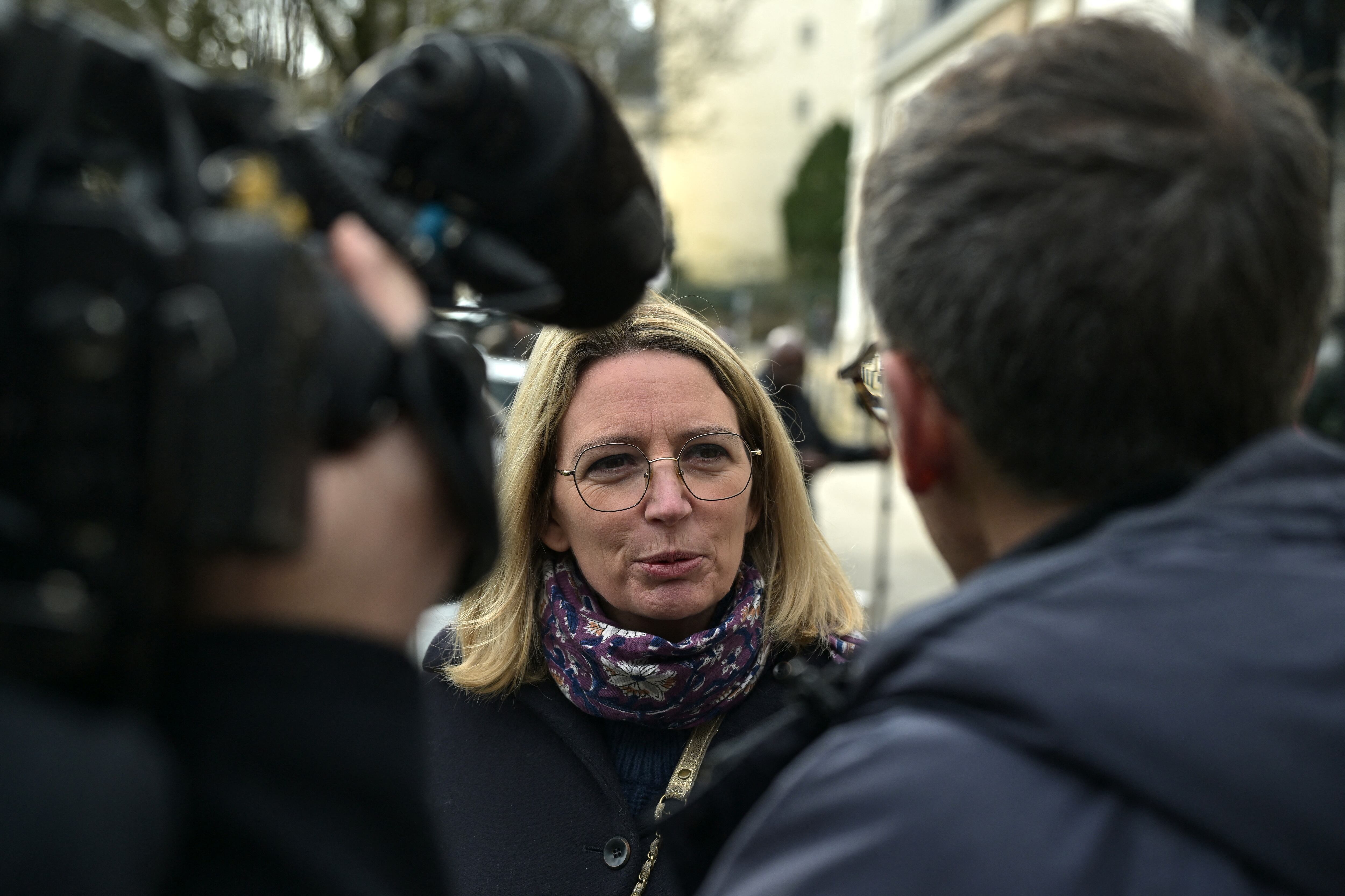 One of the victims of retired surgeon Joel Le Scouarnec, Amelie Leveque-Merle, speaks to the press during the trial of Joel Le Scouarnec on charges of assaulting or raping 299 patients at the Criminal Court in Vannes, western France, on February 25, 2025. Scouarnec, 74, faces a new four-month