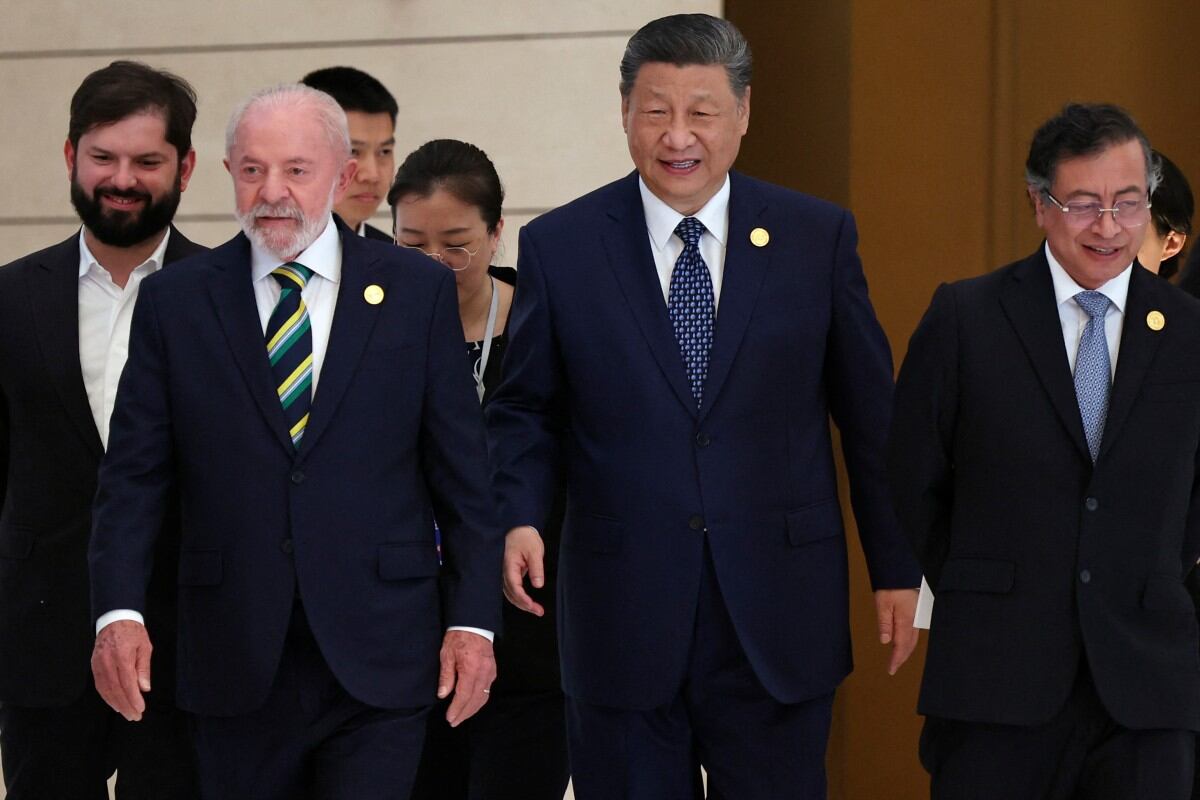 Chinese President Xi Jinping applauds after a joint press conference with Brazil's President Luiz Inacio Lula da Silva (not pictured) at the Great Hall of the People in Beijing on May 13, 2025. (Photo by TINGSHU WANG / POOL / AFP)