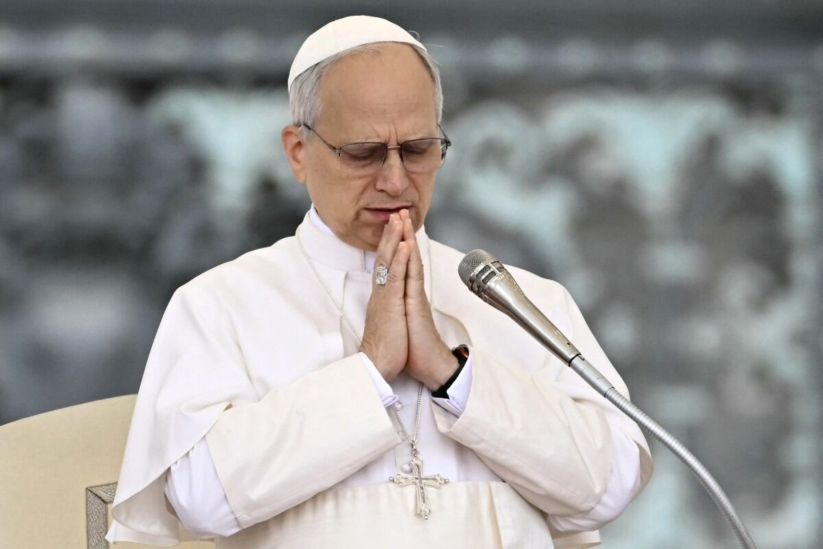 Pope Leo XIV waves to the crowd during the weekly general audience at St Peter's Square in The Vatican on May 21, 2025. (Photo by Filippo MONTEFORTE / AFP)