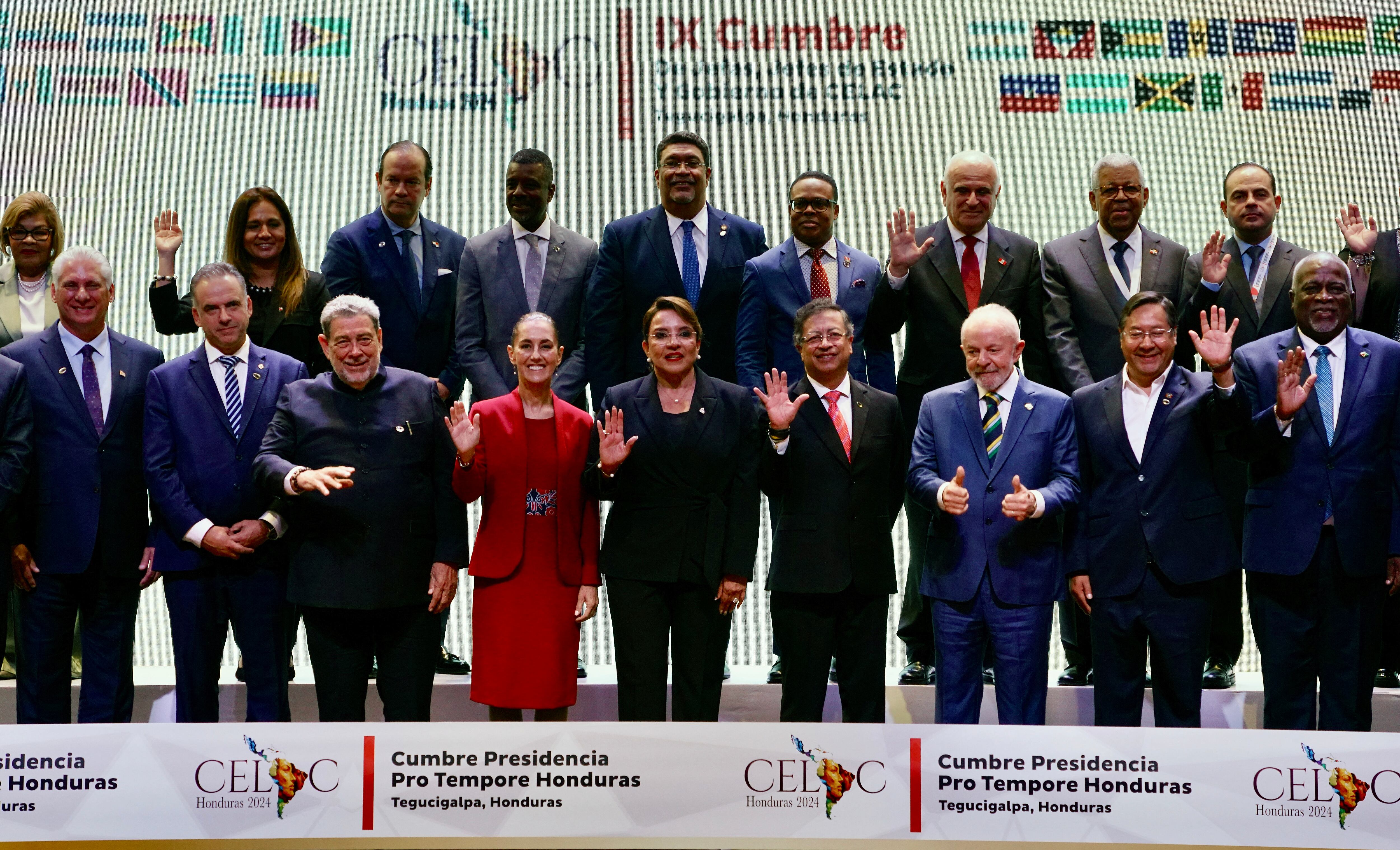 Participants are silhouetted against a screen during the Ministerial Meeting of the Community of Latin American and Caribbean States (CELAC), at the Central Bank of Honduras (BCH) in Tegucigalpa on April 8, 2025, on the eve of the IX CELAC Summit. A dozen Latin American and Caribbean presidents, including those of Brazil, Colombia, and Mexico, will meet on April 9 in Honduras during the 33-nation CELAC summit, in the midst of US President Donald Trump's trade war. (Photo by Orlando SIERRA / AFP)