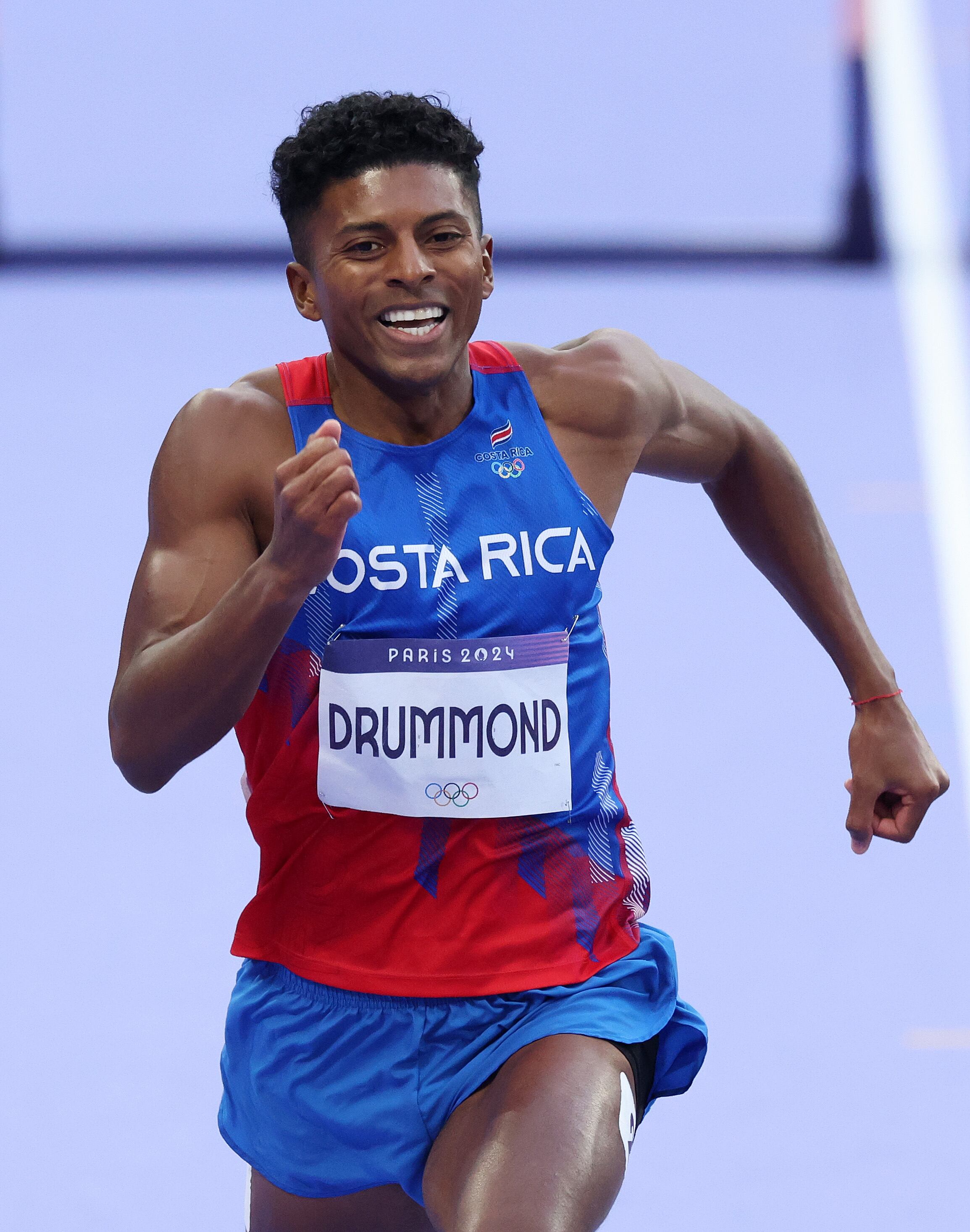 PARIS, FRANCE - AUGUST 07: Gerald Drummond of Team Costa Rica competes in the Men's 400m Hurdles Semi-Final on day twelve of the Olympic Games Paris 2024 at Stade de France on August 07, 2024 in Paris, France. (Photo by Al Bello/Getty Images)