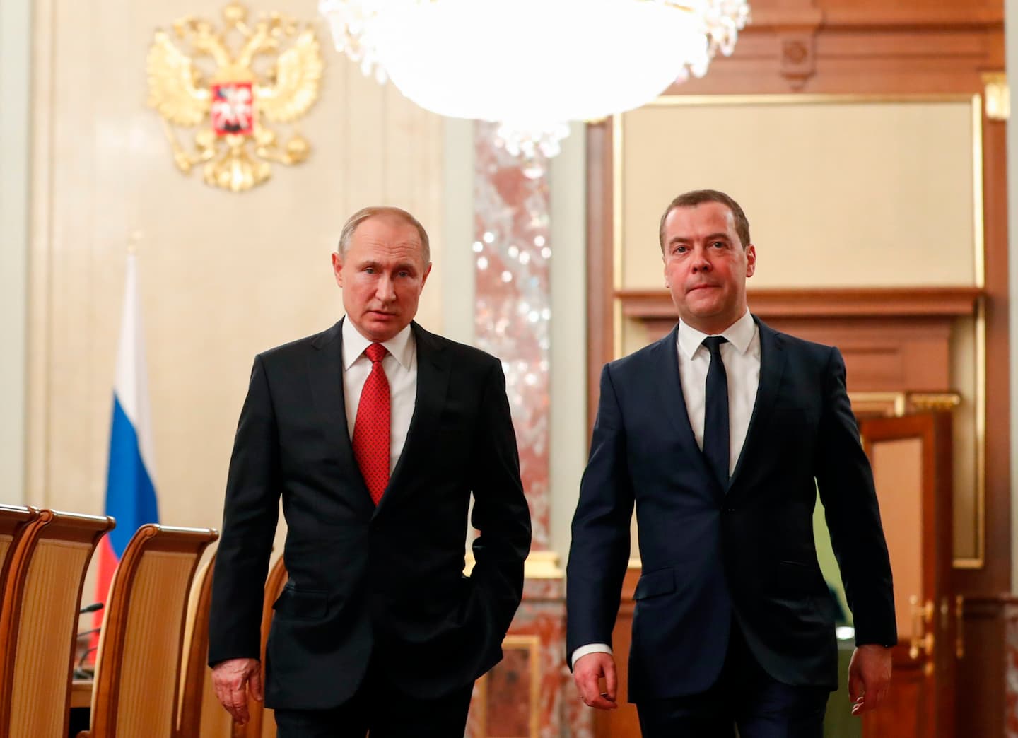Russian President Vladimir Putin, left, and Russian Prime Minister Dmitry Medvedev walk prior to a cabinet meeting in Moscow, Russia, Wednesday, Jan. 15, 2020. The Tass news agency reports Wednesday that Russian Prime Minister Dmitry Medvedev submitted his resignation to President Vladimir Putin. Russian news agencies said Putin thanked Medvedev for his service but noted that the prime minister's Cabinet failed to fulfil all the objectives set for it. (Dmitry Astakhov, Sputnik, Government Pool Photo via AP)