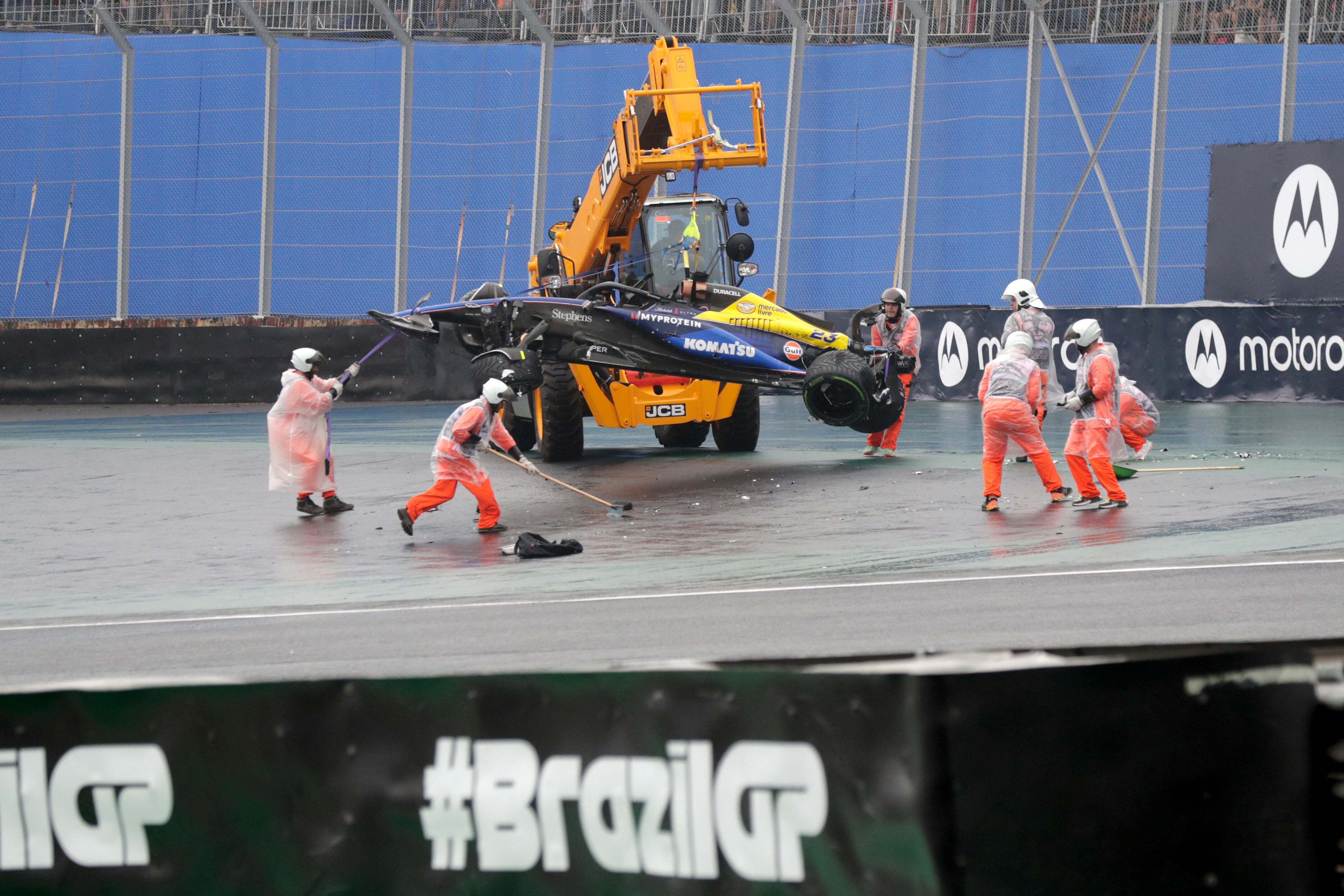 The car of Williams' Argentine driver Franco Colapinto is removed from the track after an accident during the qualifying session for the Formula One Sao Paulo Grand Prix, at the Jose Carlos Pace racetrack, aka Interlagos, in Sao Paulo, Brazil, on November 3, 2024. (Photo by Sebastiao Moreira / POOL / AFP)