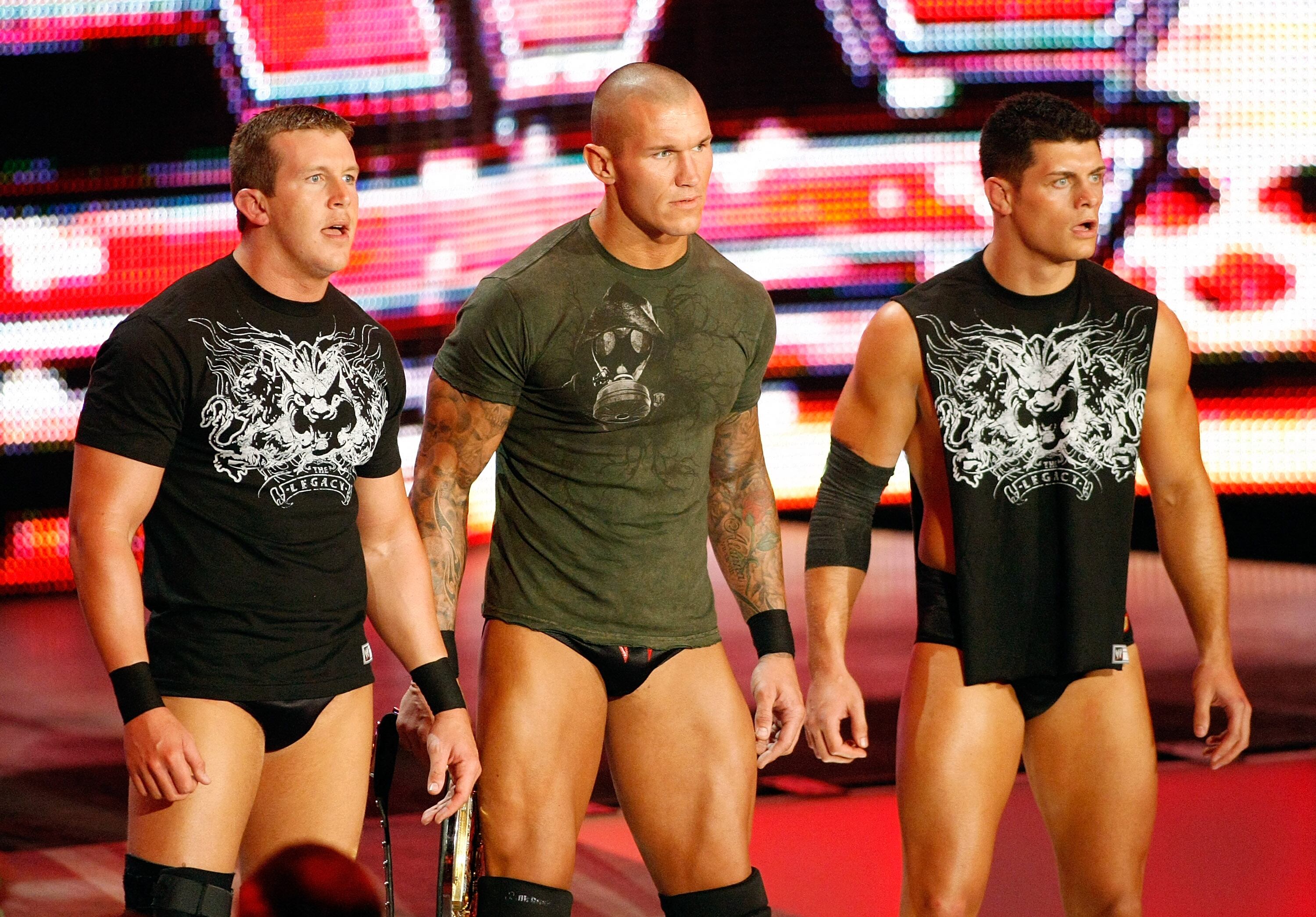 LAS VEGAS - AUGUST 24: (L-R) Wrestlers Ted DiBiase, Randy Orton and Cody Rhodes appear during the WWE Monday Night Raw show at the Thomas & Mack Center August 24, 2009 in Las Vegas, Nevada. Ethan Miller/Getty Images/AFP (Photo by Ethan Miller / GETTY IMAGES NORTH AMERICA / Getty Images via AFP)
