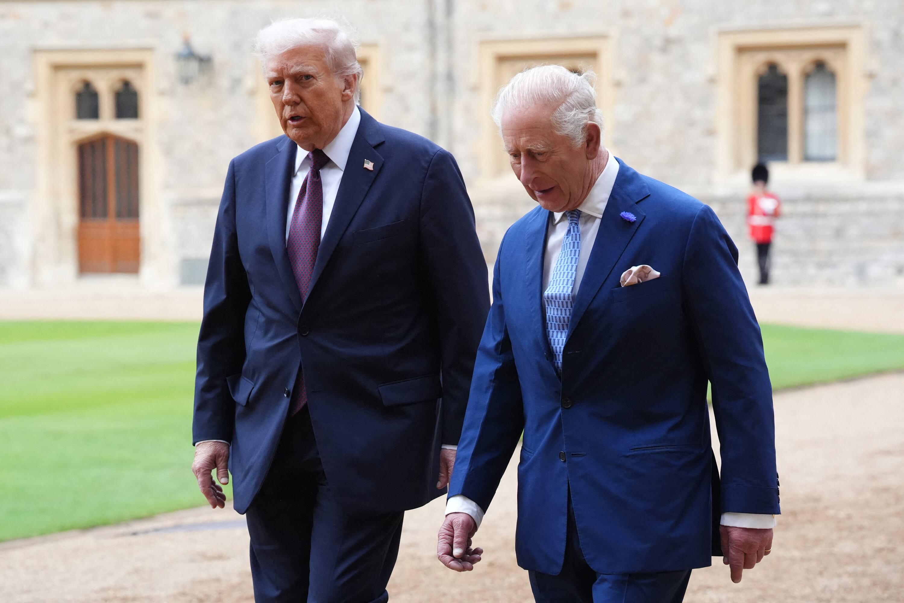 (L-R) US President Donald Trump and Britain's King Charles III during a Ceremonial Welcome in the Quadrangle at Windsor Castle, in Windsor, on September 17, 2025, during the US President's second State Visit. US President Donald Trump arrived in Britain for an unprecedented second State Visit, with the UK government rolling out a royal red carpet welcome to win over the mercurial leader. (Photo by Jonathan Brady / POOL / AFP)