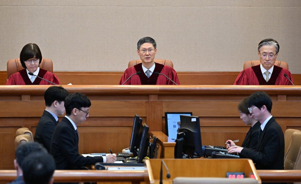 Moon Hyung-bae (C), acting chief justice of South Korea's Constitutional Court, speaks during the final ruling of South Korean president Yoon Suk Yeol's impeachment at the Constitutional Court in Seoul on April 4, 2025. (Photo by KIM Min-Hee / POOL / AFP)