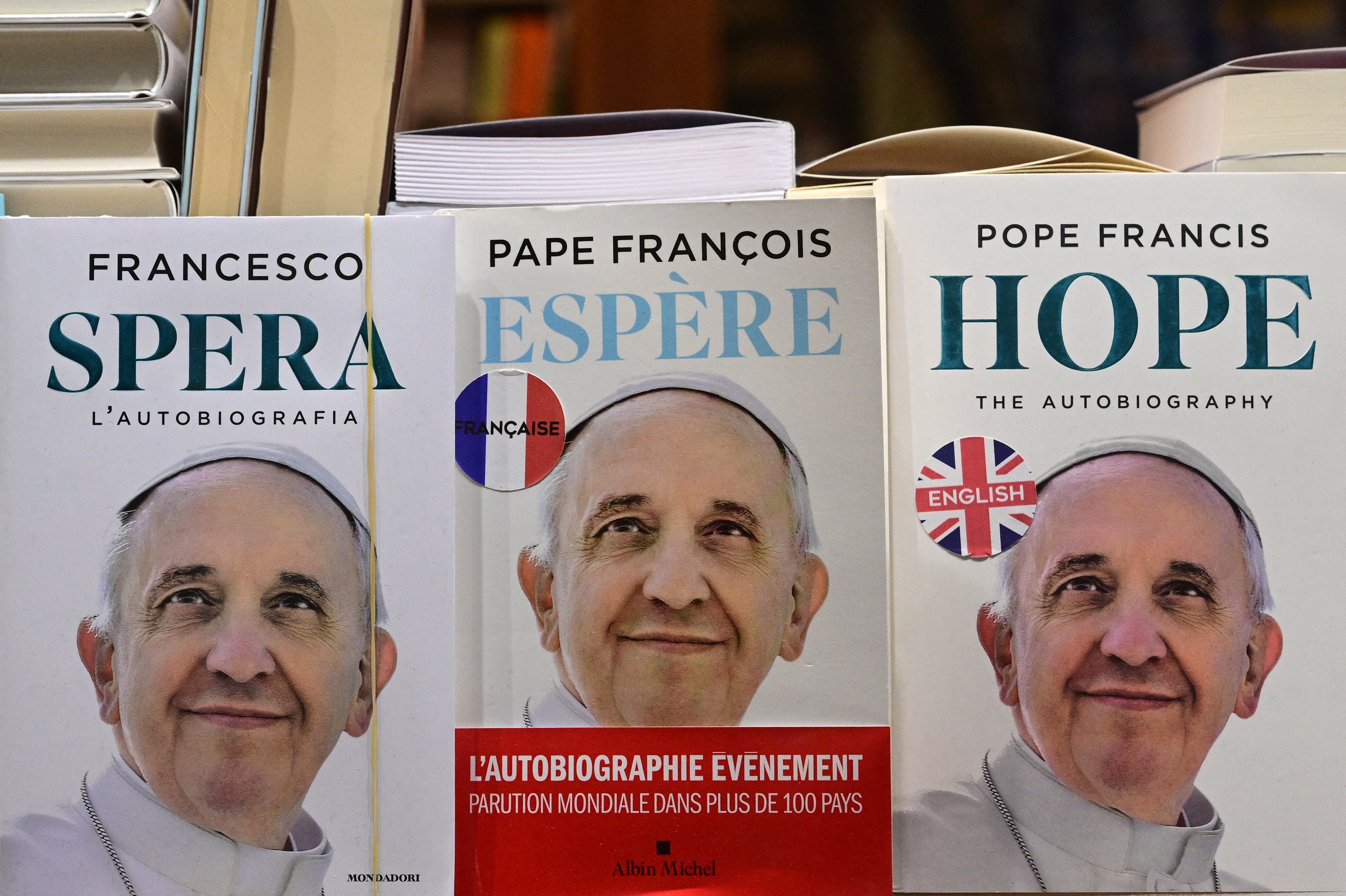 A bookshop displays autobiographies of Pope Francis in the shopwindow, near St Peter's square, in The Vatican on March 03, 2025. Pope Francis suffered two new breathing attacks on March 3, 2025, the Vatican said, as the 88-year-old pontiff struggles to recover from pneumonia. "Today, the Holy Father experienced two episodes of acute respiratory failure, caused by a significant accumulation of endobronchial mucus and consequent bronchospasm," it said in a statement. (Photo by Tiziana FABI / AFP)