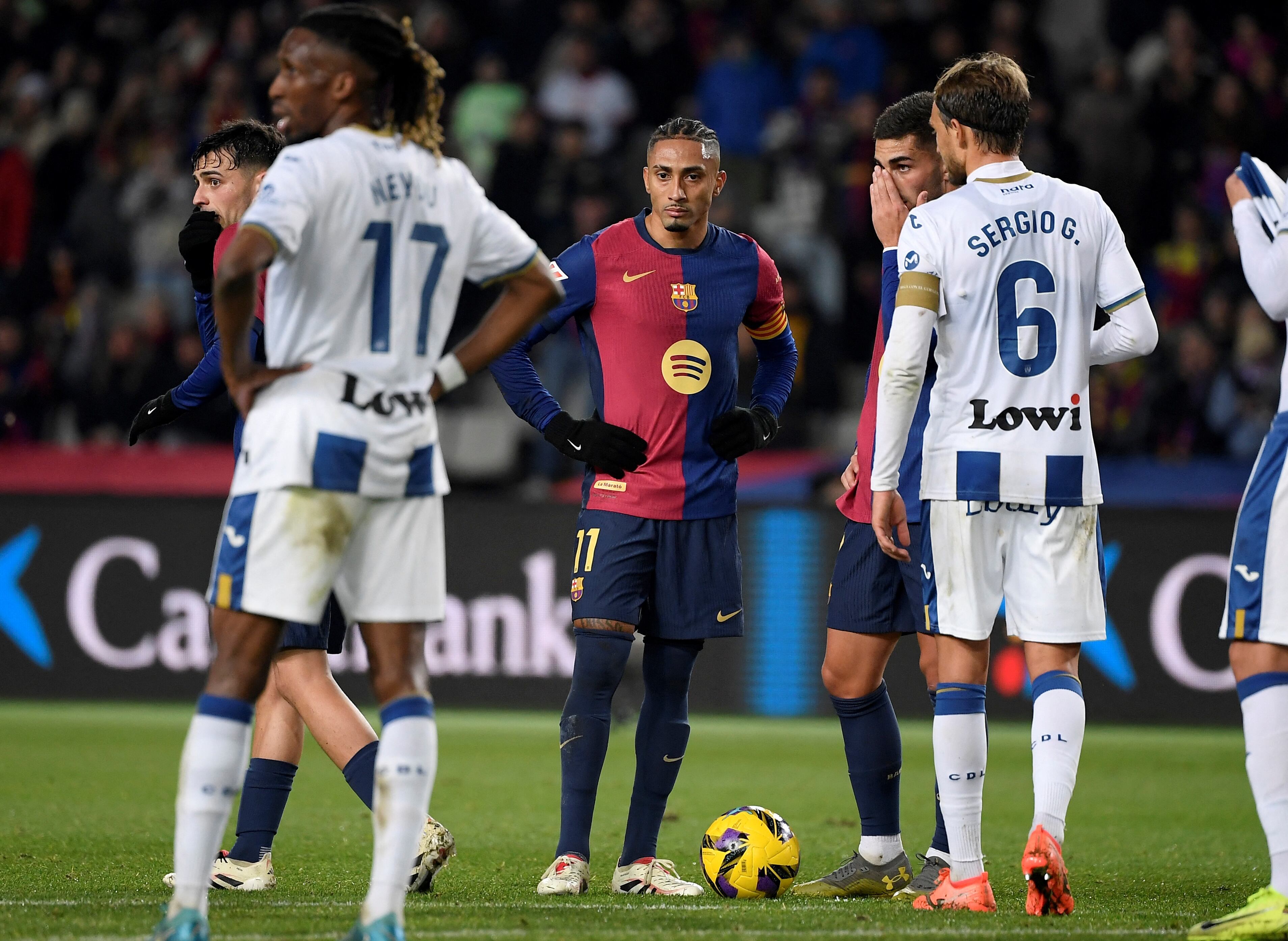 Barcelona's Brazilian forward #11 Raphinha looks deflected at the end of the Spanish league football match between FC Barcelona and Club Deportivo Leganes SAD at the Estadi Olimpic Lluis Companys in Barcelona on December 15, 2024. Leganes won 0-1. (Photo by Josep LAGO / AFP)