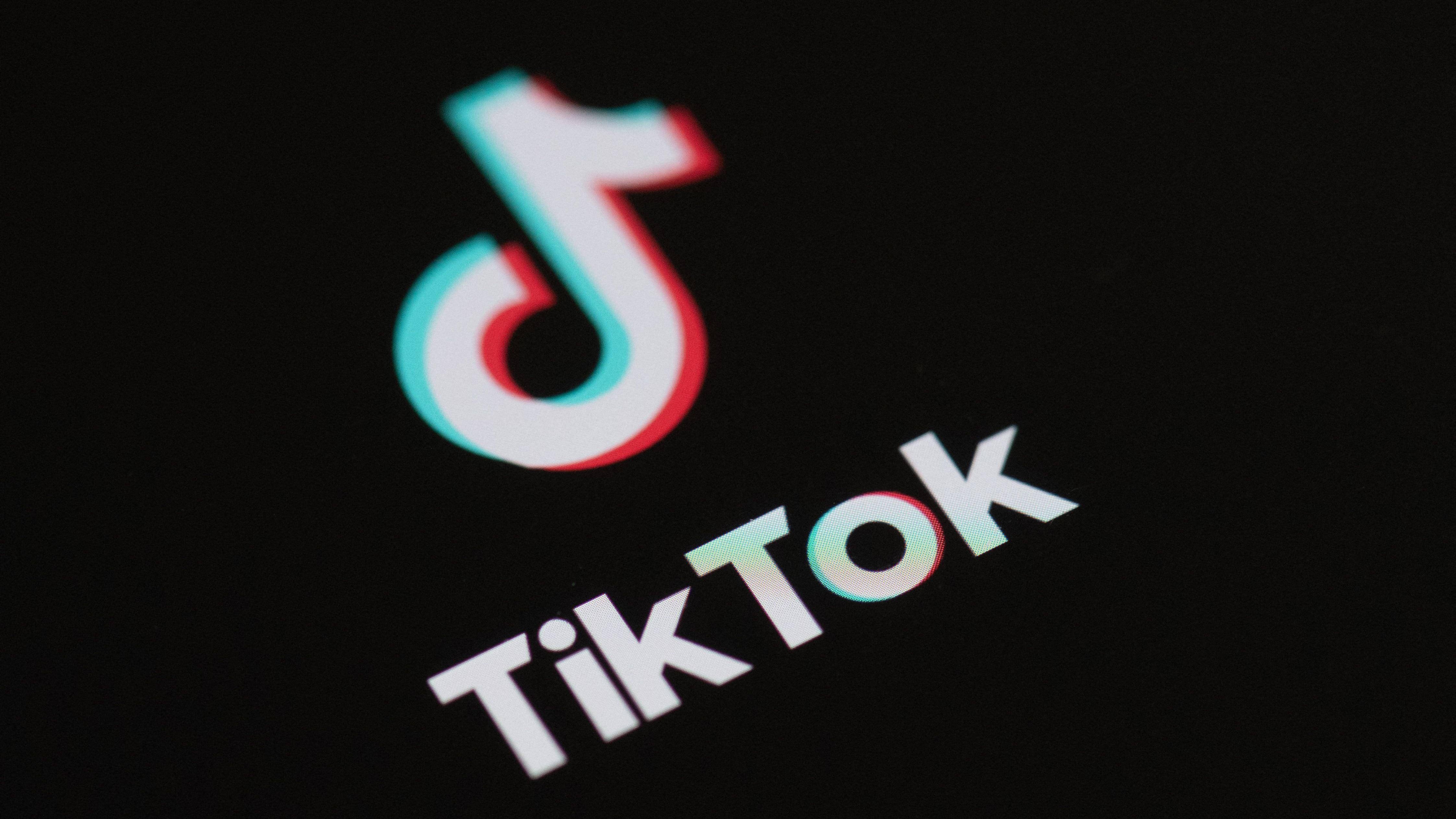 (FILES) This illustration picture taken on May 27, 2020 in Paris shows the logo of the social network application Tik Tok on the screen of a phone. TikTok will "go dark" in the United States on Sunday unless the government gives clear assurances that service providers won't be held liable for breaking a law banning the video-sharing platform, it said January 17.