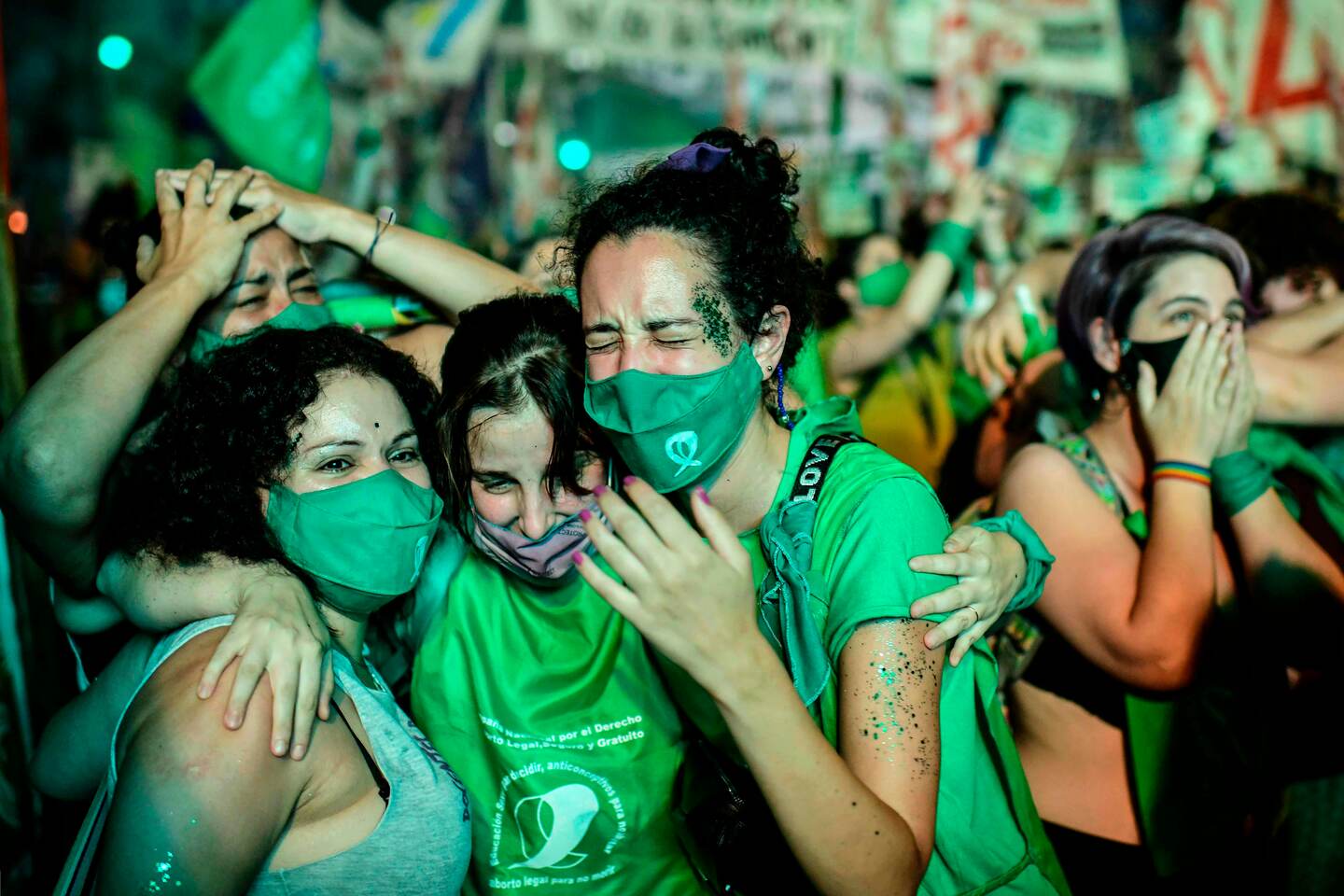 TOPSHOT - Pro-choice activists celebrate after the Senate approved a bill to legalize abortion outside the Congress in Buenos Aires on December 30, 2020. (Photo by RONALDO SCHEMIDT / AFP)