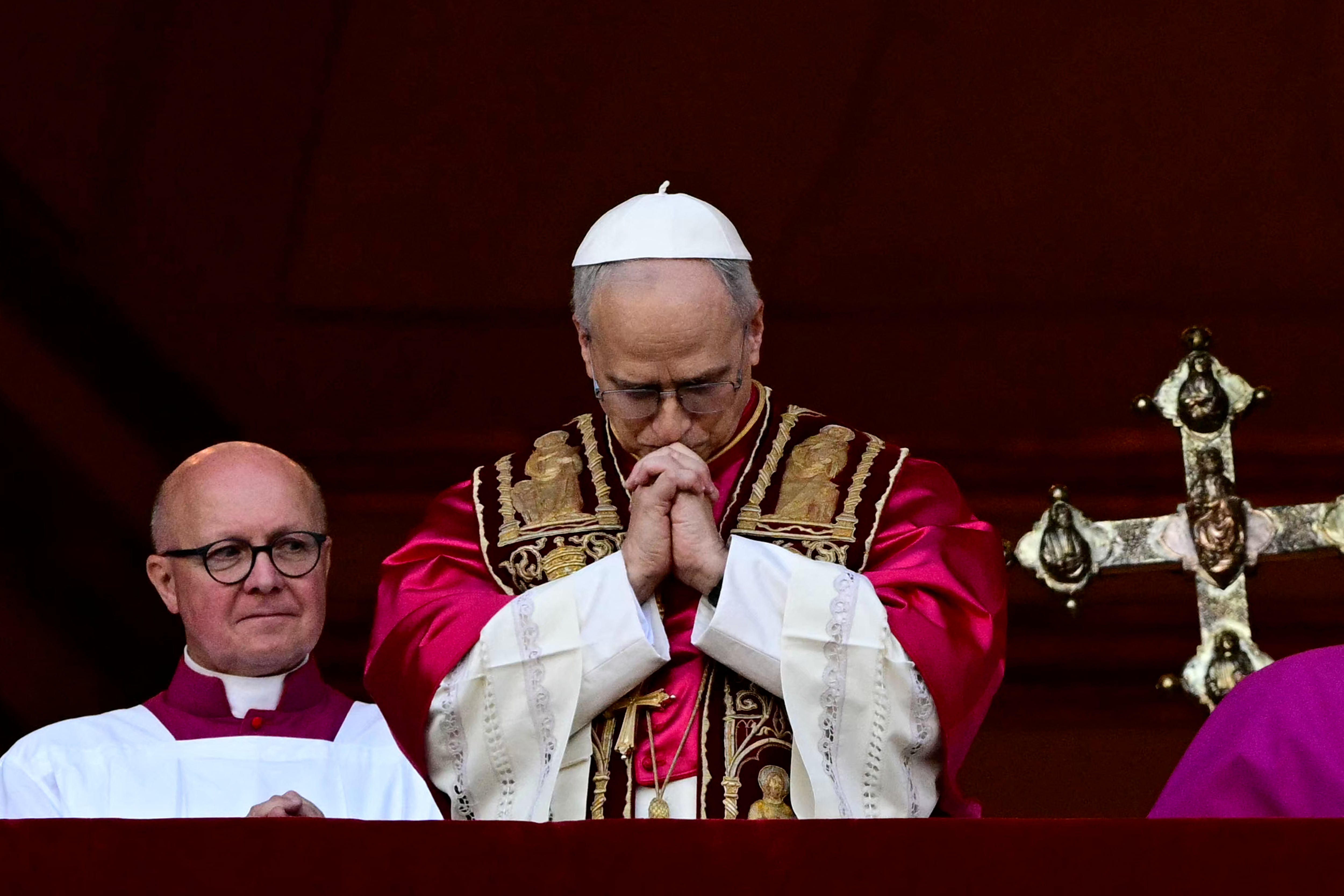 Newly elected Pope Leo XIV, Robert Prevost addresses the crowd on the main central loggia balcony of the St Peter's Basilica for the first time, after the cardinals ended the conclave, in The Vatican, on May 8, 2025. Robert Francis Prevost was on Thursday elected the first pope from the United States, the Vatican announced. A moderate who was close to Pope Francis and spent years as a missionary in Peru, he becomes the Catholic Church's 267th pontiff, taking the papal name Leo XIV. (Photo by Tiziana FABI / AFP)