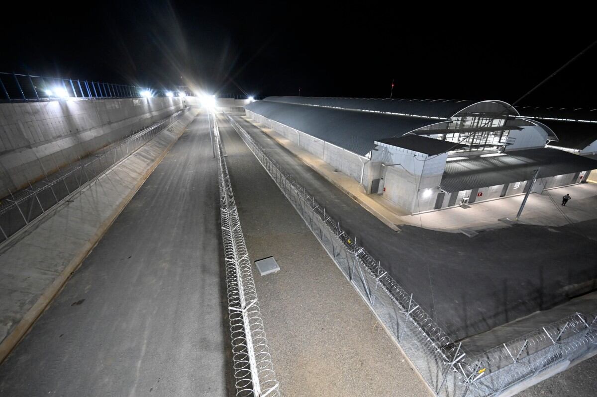 (FILES) This picture taken on February 2, 2023, shows a general view of the newly inaugurated "Terrorist Confinement Centre" (CECOT), at a secluded rural area in a valley near Tecoluca, 74 km southeast of San Salvador. Lawyers hired by the Venezuelan government last week requested El Salvador's President Nayib Bukele to open "communication channels" to solve the case of 252 Venezuelan migrants imprisoned in this country after being deported by the United States, yet their efforts have been unsuccessful. (Photo by Marvin RECINOS / AFP)
