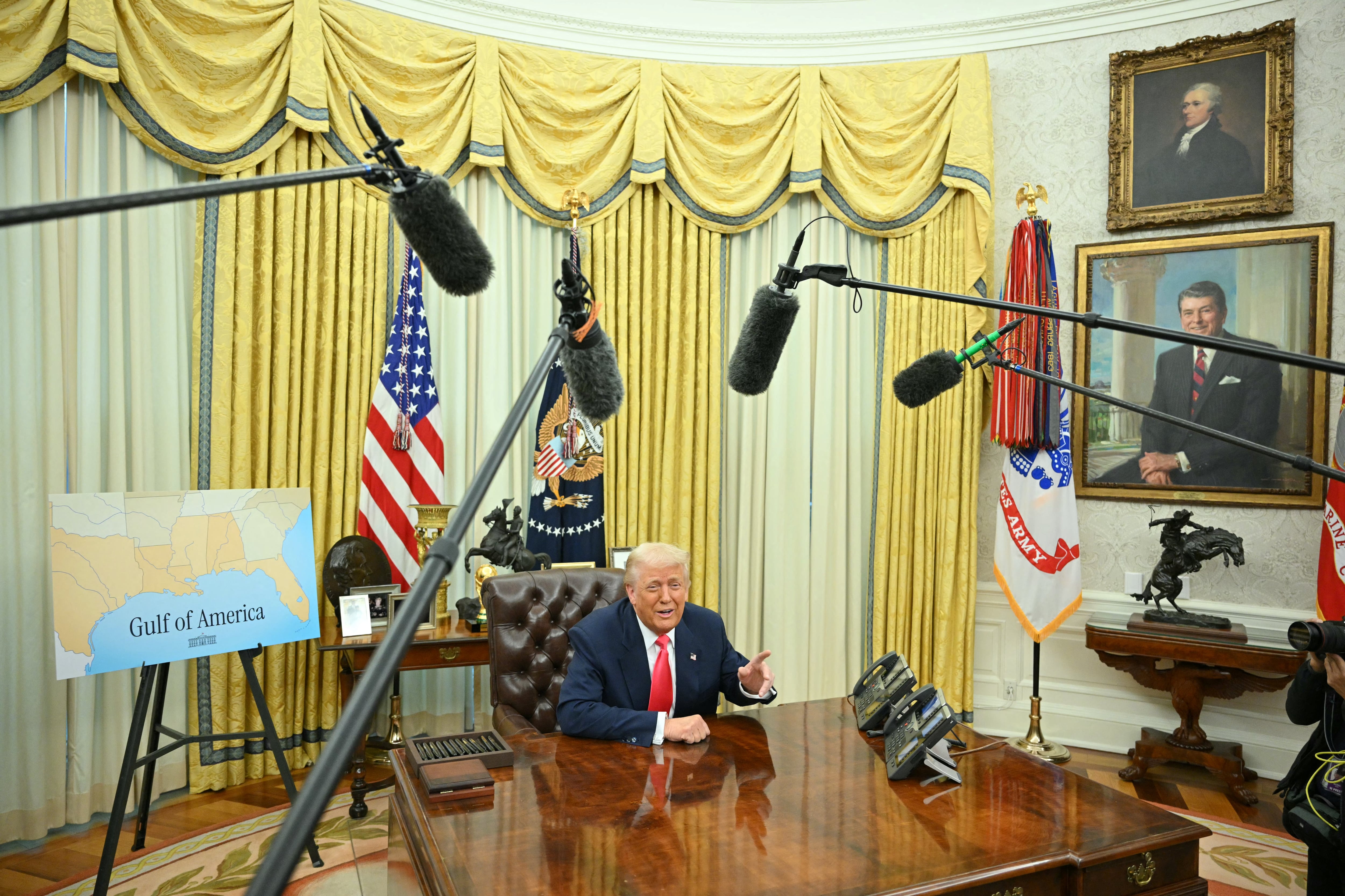 (FILES) US President Donald Trump jokes with reporters about going into space after signing executive orders in the Oval Office of the White House in Washington, DC on March 6, 2025. Donald Trump promised a new "Golden Age" for America. In the Oval Office, at least, he has lived