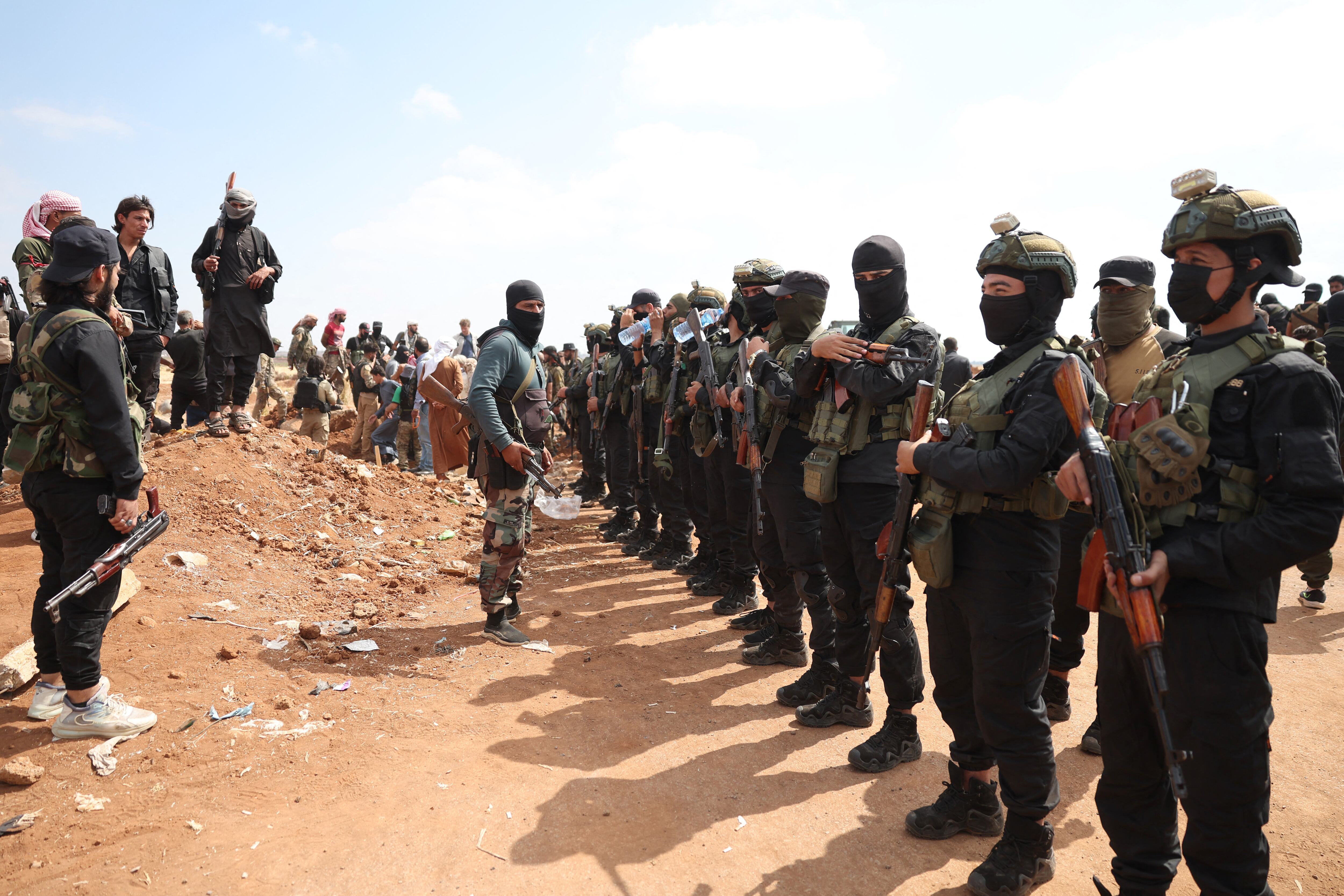 Syrian government security forces set up a checkpoint in the town of Busra al-Hariri, east of the city of Sweida, on July 20, 2025, to prevent armed tribal fighters from advancing towards the city. A ceasefire announced on July 19, appeared to be holding after earlier agreements failed to end fighting between longtime rivals the Druze and the Bedouin that spiralled to draw in the Islamist-led government, the Israeli military and armed tribes from other parts of Syria.