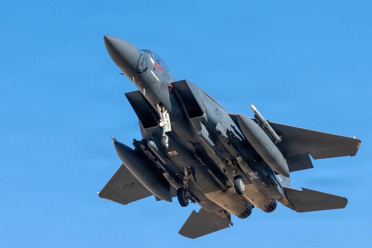 This US Air Force handout photo released by US Central Command public affairs shows an F-15E Strike Eagle aircraft taking off.