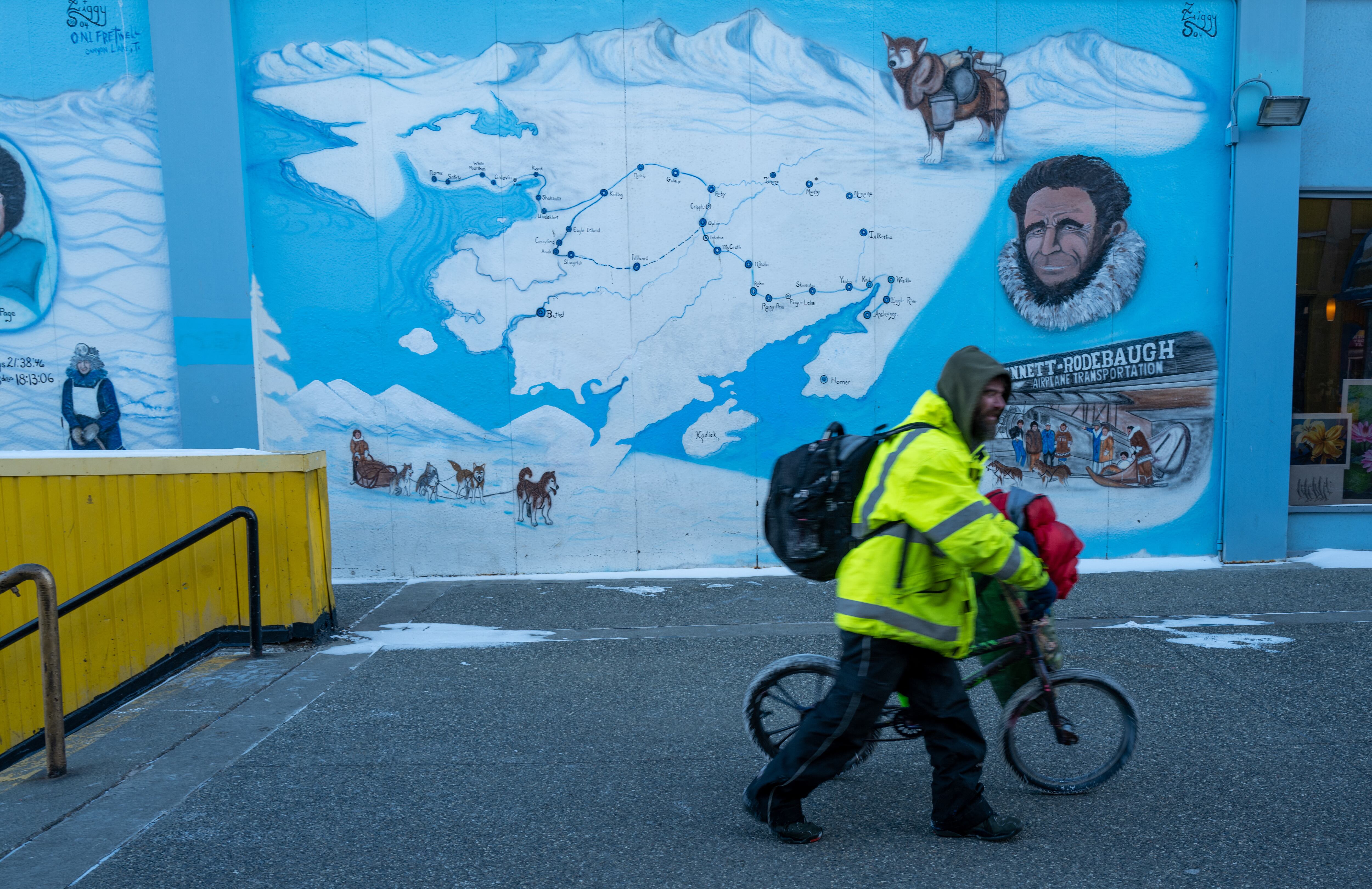 ANCHORAGE, ALASKA - NOVEMBER 05: People walk through downtown on November 05, 2022 in Anchorage, Alaska. Early and absentee voting has begun in Alaska for the decisive midterm elections at churches, community centers, town halls an other locations until Election Day on November 8th. In one of the most closely watched contests in the state, incumbent Rep. Mary Peltola (D-AK), the first Native Alaskan to be elected to the House of Representatives, is running against three candidates including former Alaska Gov. Sarah Palin in Alaska's at-large congressional district general election. Spencer Platt/Getty Images/AFP (Photo by SPENCER PLATT / GETTY IMAGES NORTH AMERICA / Getty Images via AFP)