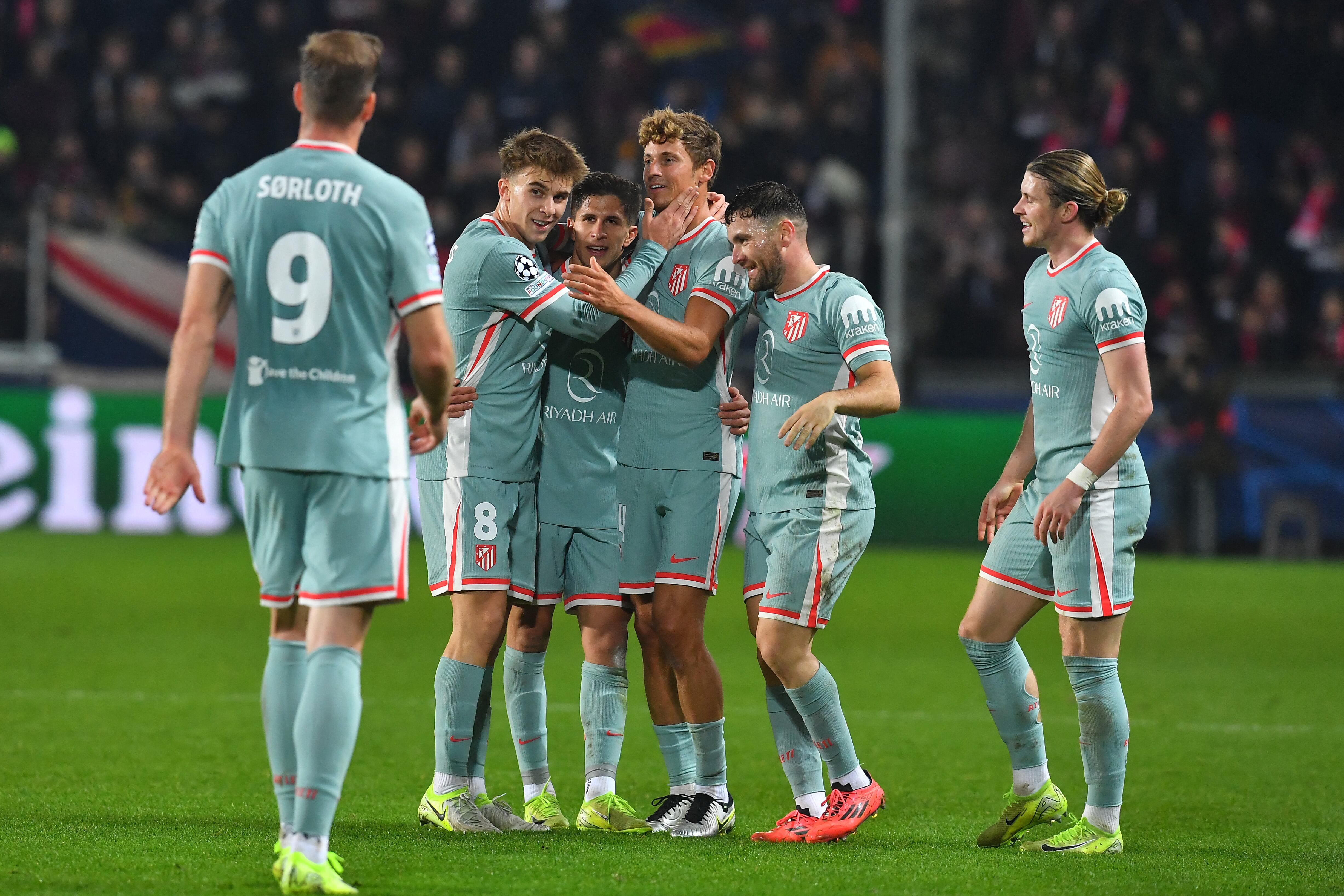 Atletico Madrid's Spanish midfielder #14 Marcos Llorente (C) celebrates scoring his team's second goal with his team mates during the UEFA Champions League football match Sparta Prague vs Atletico Madrid in Prague, Czech Republic, on November 26, 2024. (Photo by Michal Cizek / AFP)