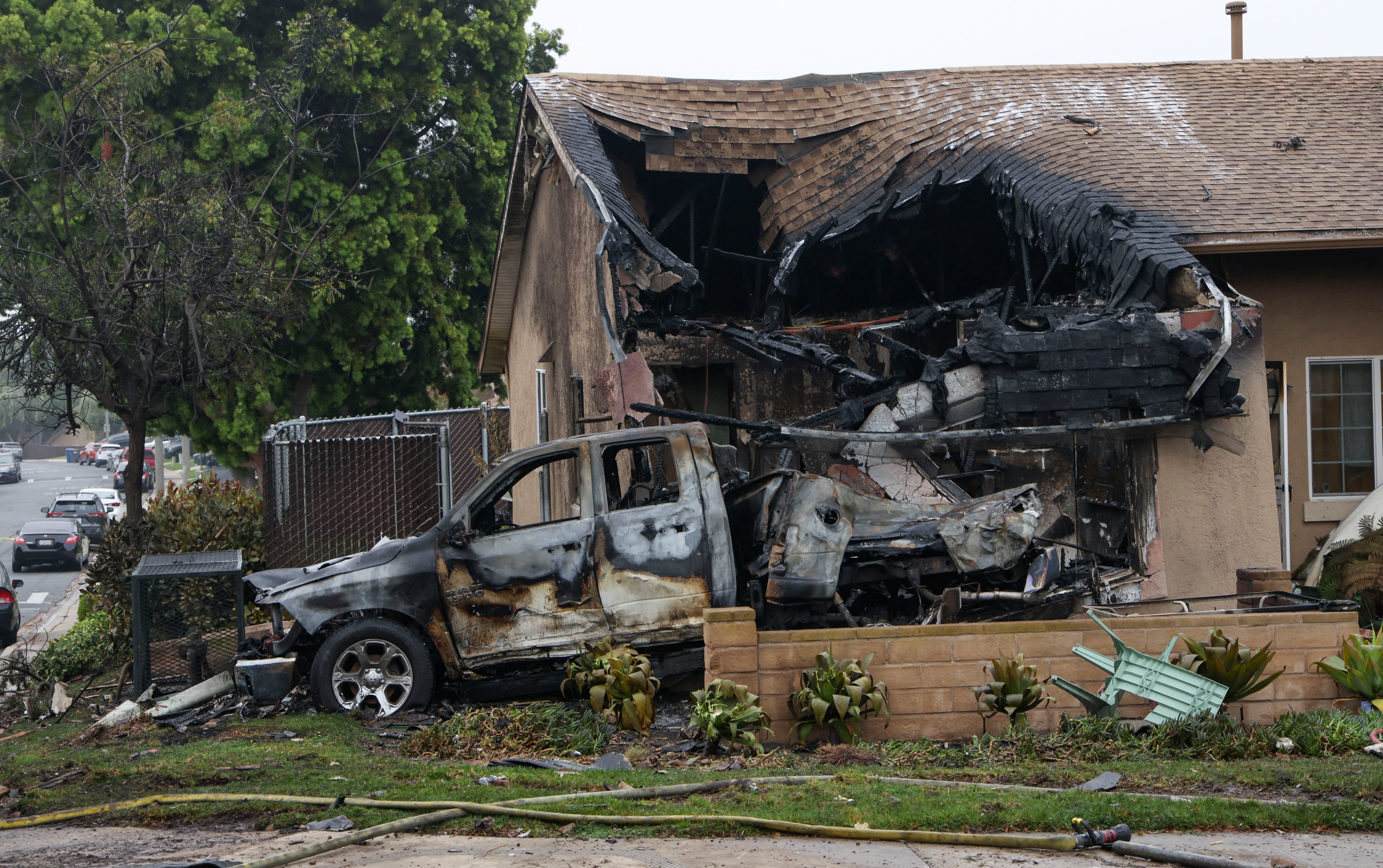 A home is partially destroyed where a small plane crashed into a San Diego, California, residential street on May 22, 2025. The Federal Aviation Authority said a Cessna 550 crashed at around 3:45 am local time. The neighborhood is close to the Montgomery-Gibbs Executive Airport. The crash left a "gigantic debris field" and damaged some 15 homes and parked cars, ABC News quoted the San Diego assistant fire chief as saying. (Photo by Sandy Huffaker / AFP)