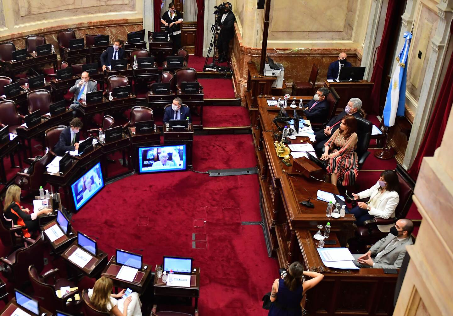 Argentina's Vice-President Cristina Fernandez de Kirchner (L) is pictured during the session at the Senate to decide whether to legalize voluntary abortions at up to 14 weeks or not, at the Congress in Buenos Aires, on December 29, 2020. - The bill proposed by President Alberto Fernandez already passed the Chamber of Deputies on December 11, despite fierce opposition from the Catholic Church and evangelical Christians. Terminations are currently only allowed in two cases: rape and danger to the mother's life. (Photo by Ronaldo SCHEMIDT / AFP)