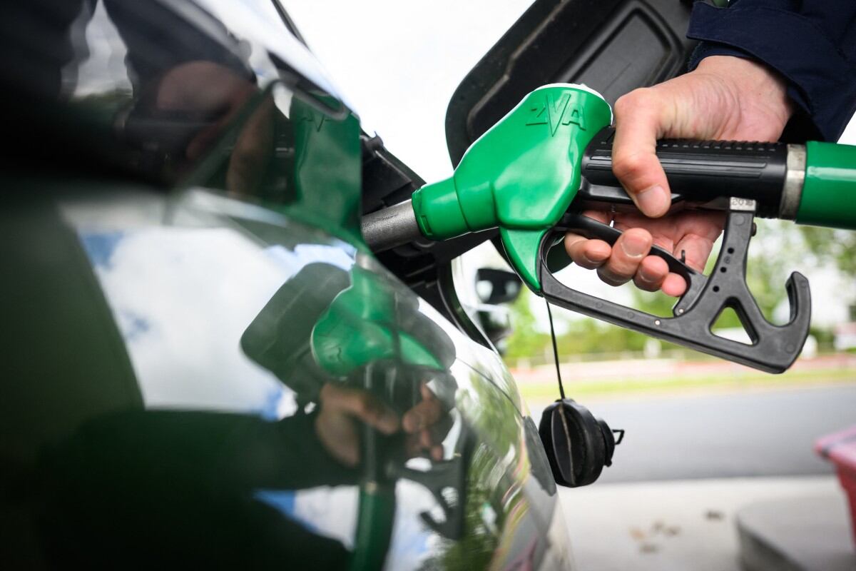 A man fills in his car with petrol at a gas station in Saint-Etienne-de-Montluc, western France, on April 15, 2026, as US-Israel war on Iran, launched on February 28, has roiled global energy and equities markets, sending oil prices skyrocketing after Tehran virtually closed the key Strait of Hormuz. (Photo by Loic VENANCE / AFP)