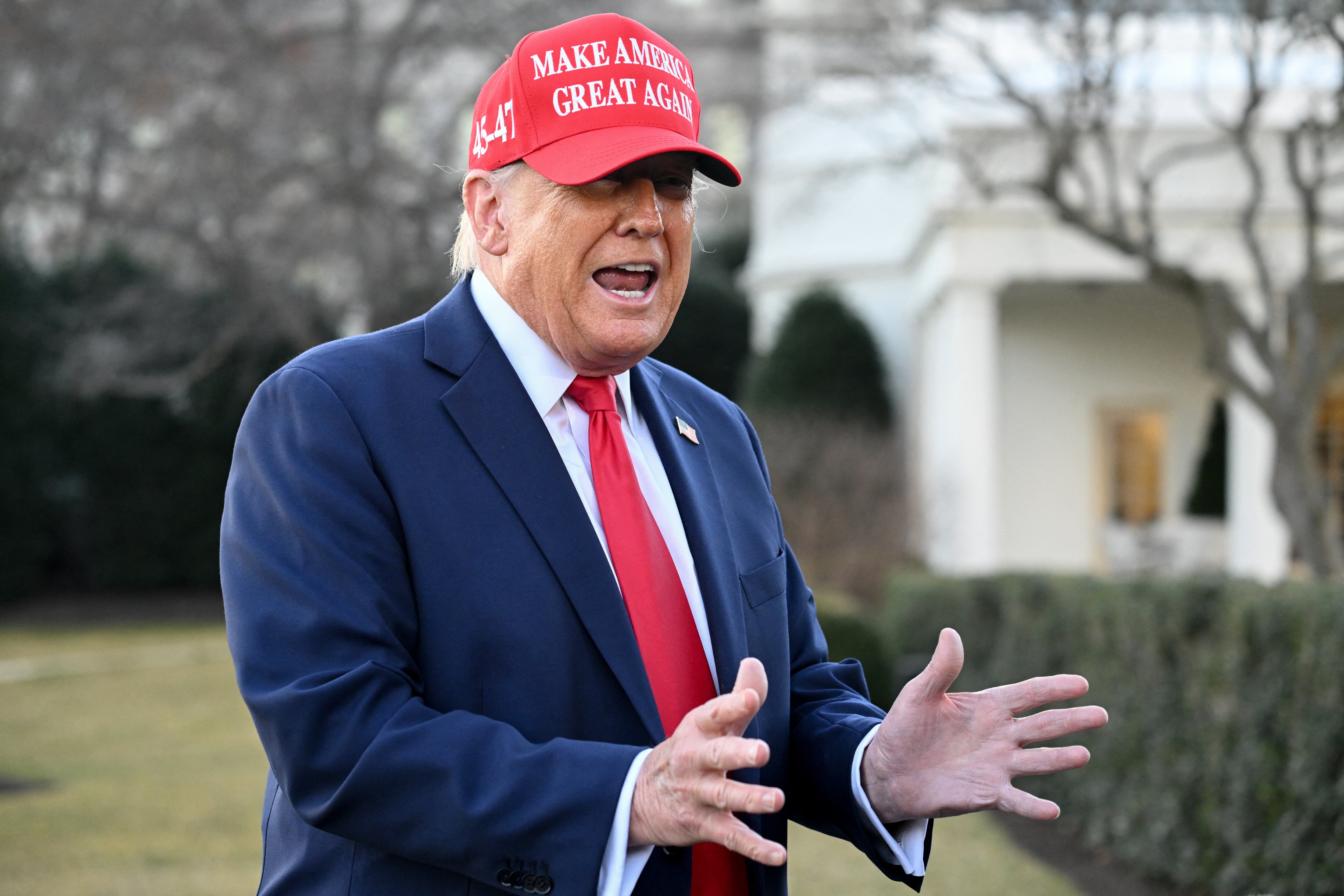 US President Donald Trump gestures as he speaks to reporters as he prepares to depart the White House in Washington, DC, on February 28, 2025, en route to his Mar-a-Lago resort in Palm Beach, Florida. (Photo by SAUL LOEB / AFP)