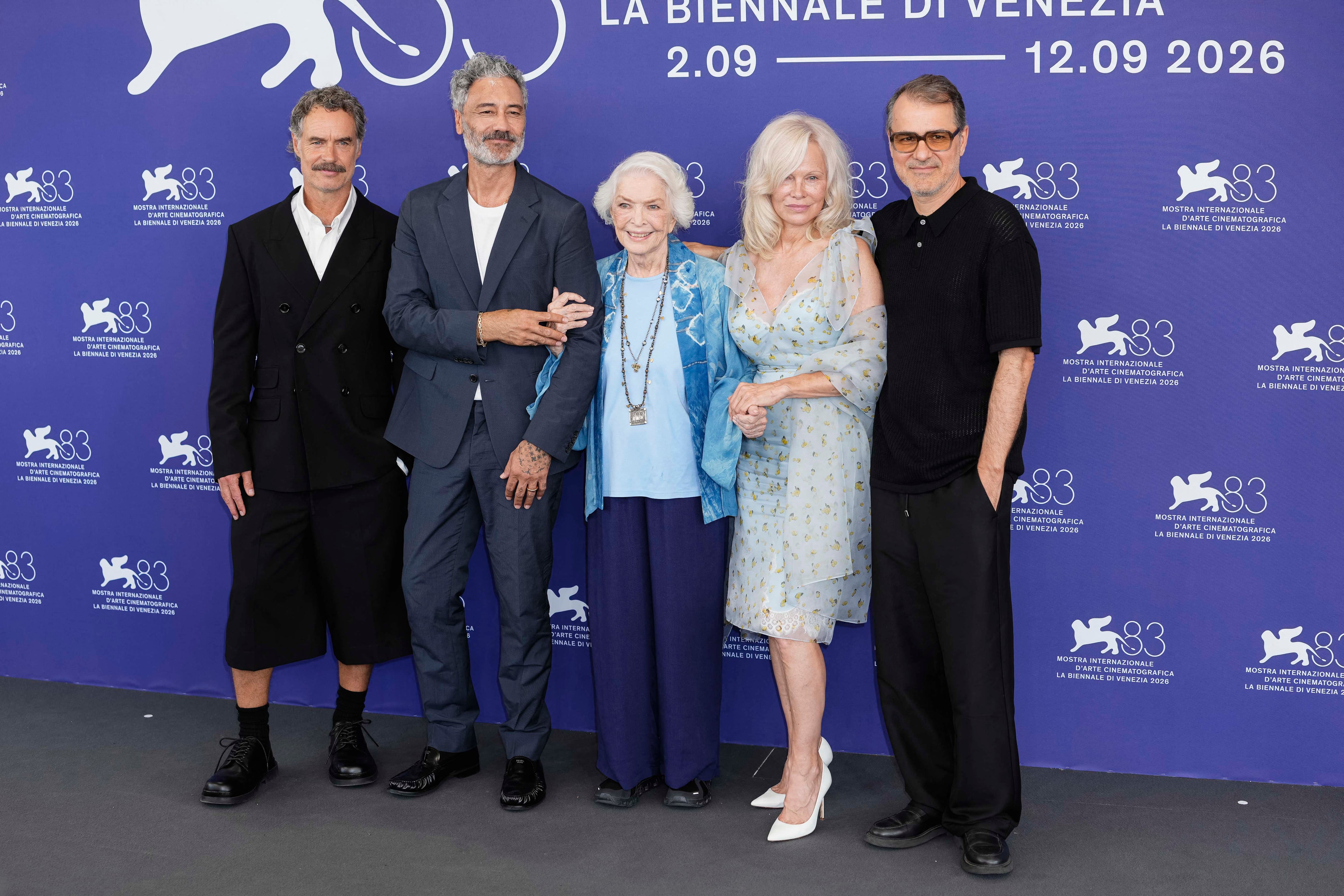 Megan Wynn, Murray Bartlett, Taika Waititi, Ellen Burstyn, Pamela Anderson, Director Kornel Mundruczo and Jomon Thomas attend the ''Place To Be'' Photocall during the 83rd Venice International Film Festival at Palazzo del Casino on September 09, 2026 in Venice, Italy. (Photo by Daniele Cifal� / NurPhoto via AFP)