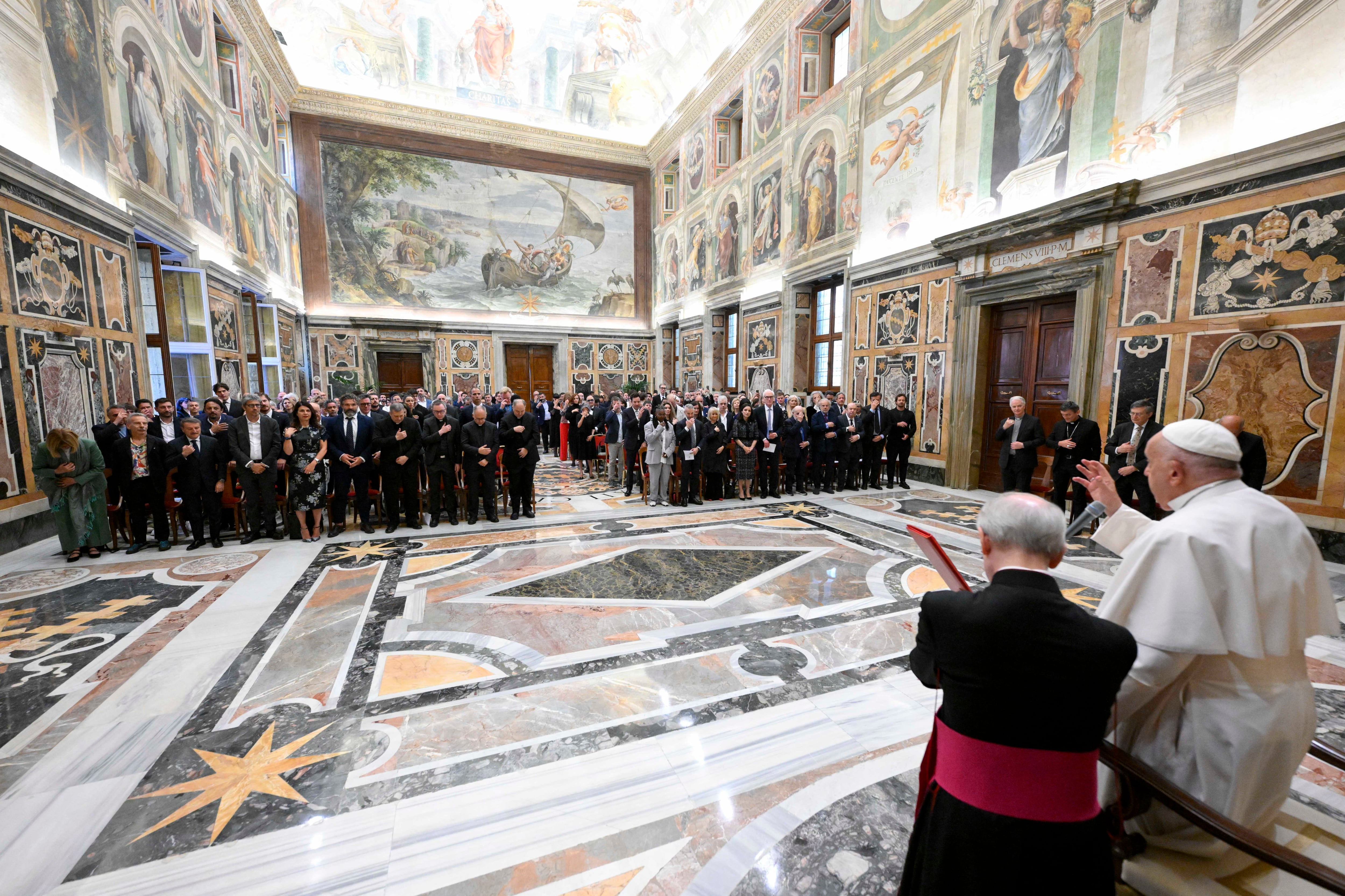 This photo taken and handout on June 14, 2024 by The Vatican Media shows Pope Francis during an audience with comedians in The Vatican. (Photo by Simone Risoluti / VATICAN MEDIA / AFP) / RESTRICTED TO EDITORIAL USE - MANDATORY CREDIT "AFP PHOTO / VATICAN MEDIA" - NO MARKETING - NO ADVERTISING CAMPAIGNS - DISTRIBUTED AS A SERVICE TO CLIENTS