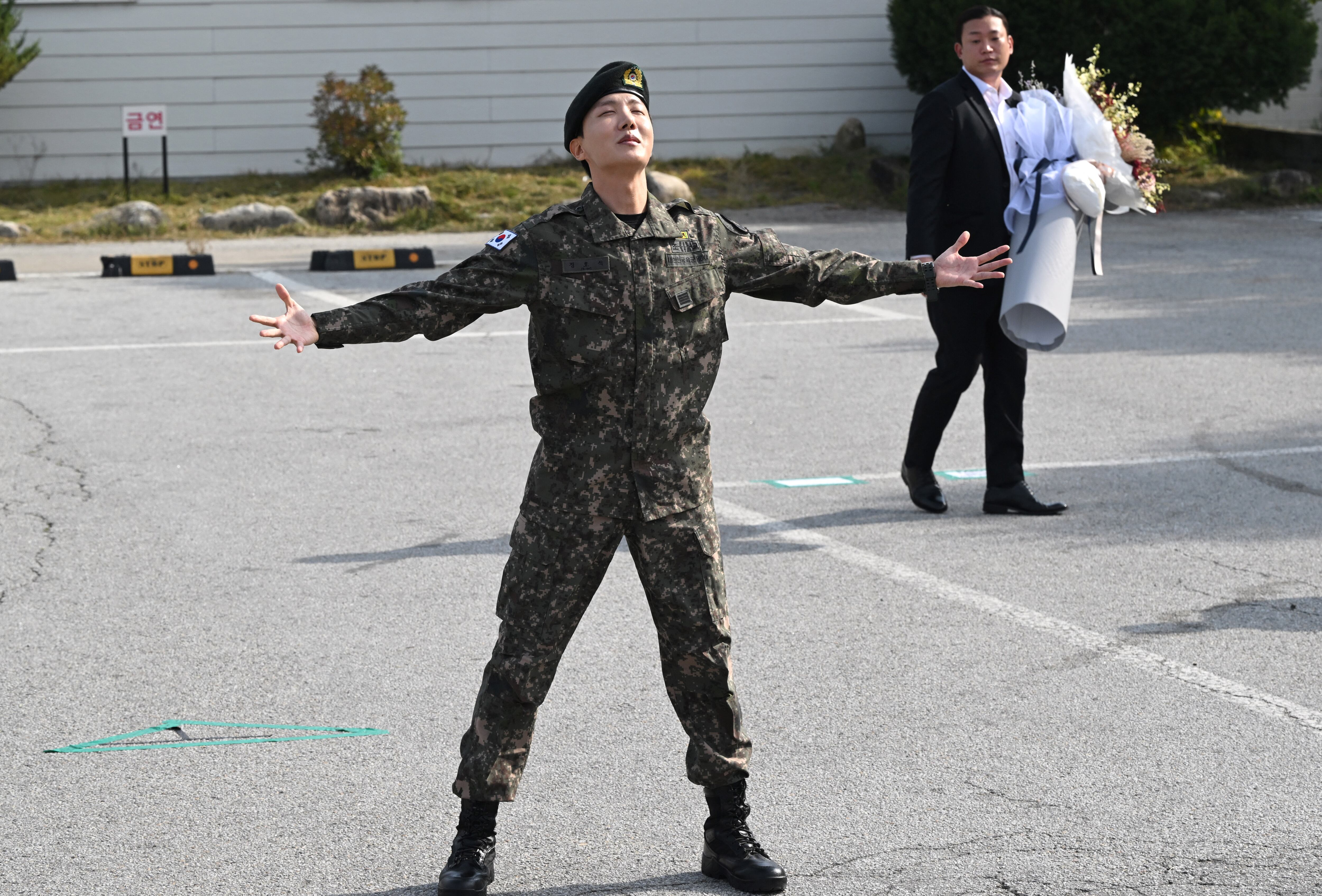 BTS member J-hope reacts after being discharged from his mandatory military service outside a military base in Wonju on October 17, 2024. (Photo by JUNG YEON-JE / AFP)