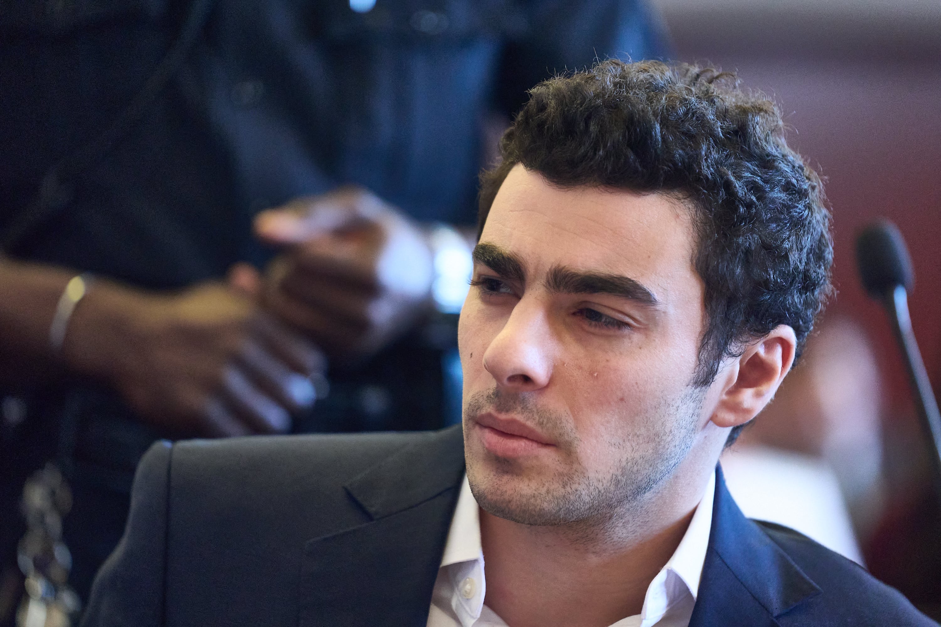 Luigi Mangione appears in Manhattan Supreme Court during an evidence suppression hearing in the murder case of United Healthcare CEO Brian Thompson, in New York, on December 18, 2025. (Photo by Curtis Means / POOL / AFP)