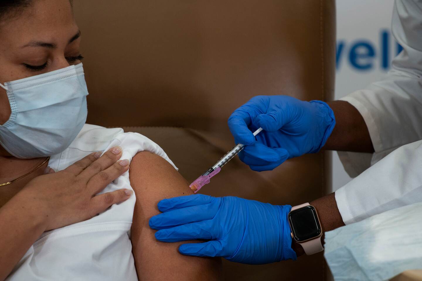 Arlene Ramirez, RN, director, patient care, ED, Long Island Jewish Valley Stream, receives the Moderna coronavirus COVID-19 vaccine at Northwell Health's Long Island Jewish Valley Stream hospital in New York City, December 21, 2020. (Photo by Eduardo MUNOZ ALVAREZ / POOL / AFP)