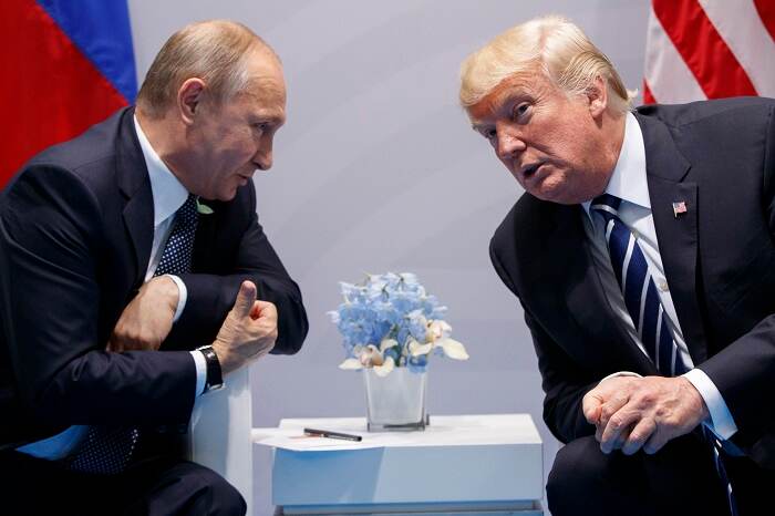 Fotografía de Vladimir Putin y Donald Trump, tomada durante la cumbre del Grupo de los 20, en Hamburgo.