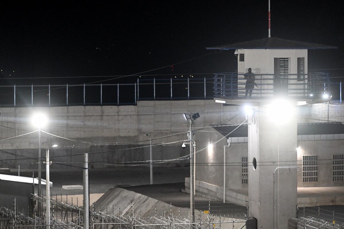 (FILES) This picture taken on February 2, 2023, shows a general view of the newly inaugurated "Terrorist Confinement Centre" (CECOT), at a secluded rural area in a valley near Tecoluca, 74 km southeast of San Salvador. Lawyers hired by the Venezuelan government last week requested El Salvador's President Nayib Bukele to open "communication channels" to solve the case of 252 Venezuelan migrants imprisoned in this country after being deported by the United States, yet their efforts have been unsuccessful. (Photo by Marvin RECINOS / AFP)