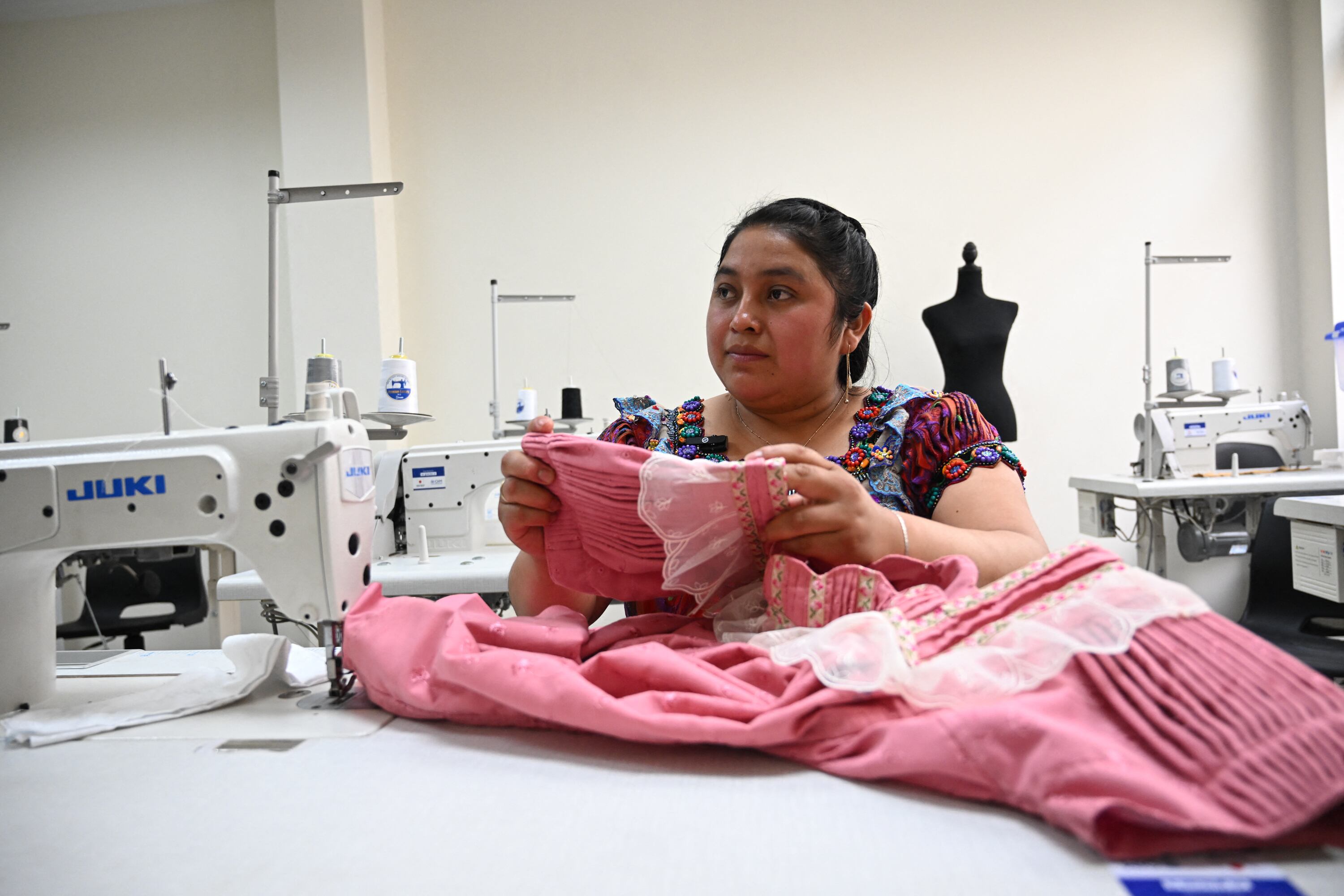 Marleny Tino-27- make a blouse at the Qu�date Training Center in Joyabaj, Guatemala on March 19,2025. Guatemala implements a technical career training program to prevent the illegal migration of young people to the United States and to support those who are deported. In the indigenous municipality of Joyabaj the program is implemented by the International Organization for Migration (IOM) in a building built with funds from Japan. (Photo by JOHAN ORDONEZ / AFP)
