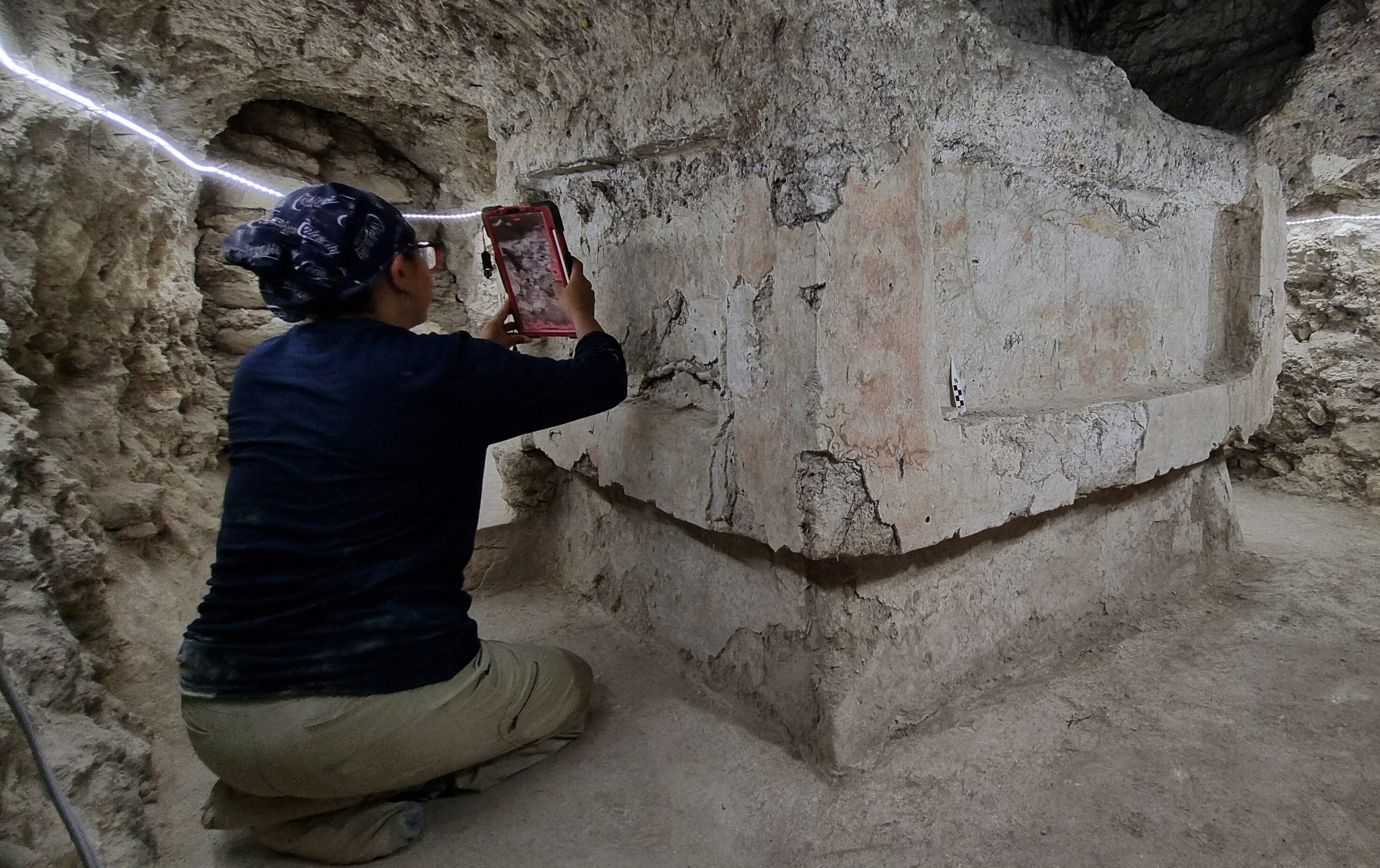 Undated handout picture released by the Guatemalan Ministry of Culture office on April 7, 2025, shows an archaeologist working on a Teotihuacan altar found in 2022 in the Tikal Mayan National Park in Guatemala. An ancient Teotihuacan altar was discovered in the Mayan city of Tikal, providing "evidence" that reaffirms the ties between these two pre-Hispanic cultures in present-day Mexico and Guatemala, archaeologists announced on April 7, 2025. (Photo by Handout / Guatemalan Ministry of Culture and Sports / AFP) / RESTRICTED TO EDITORIAL USE - MANDATORY CREDIT "AFP PHOTO / GUATEMALAN MINISTRY OF CULTURE AND SPORT / HANDOUT / " - NO MARKETING NO ADVERTISING CAMPAIGNS - DISTRIBUTED AS A SERVICE TO CLIENTS