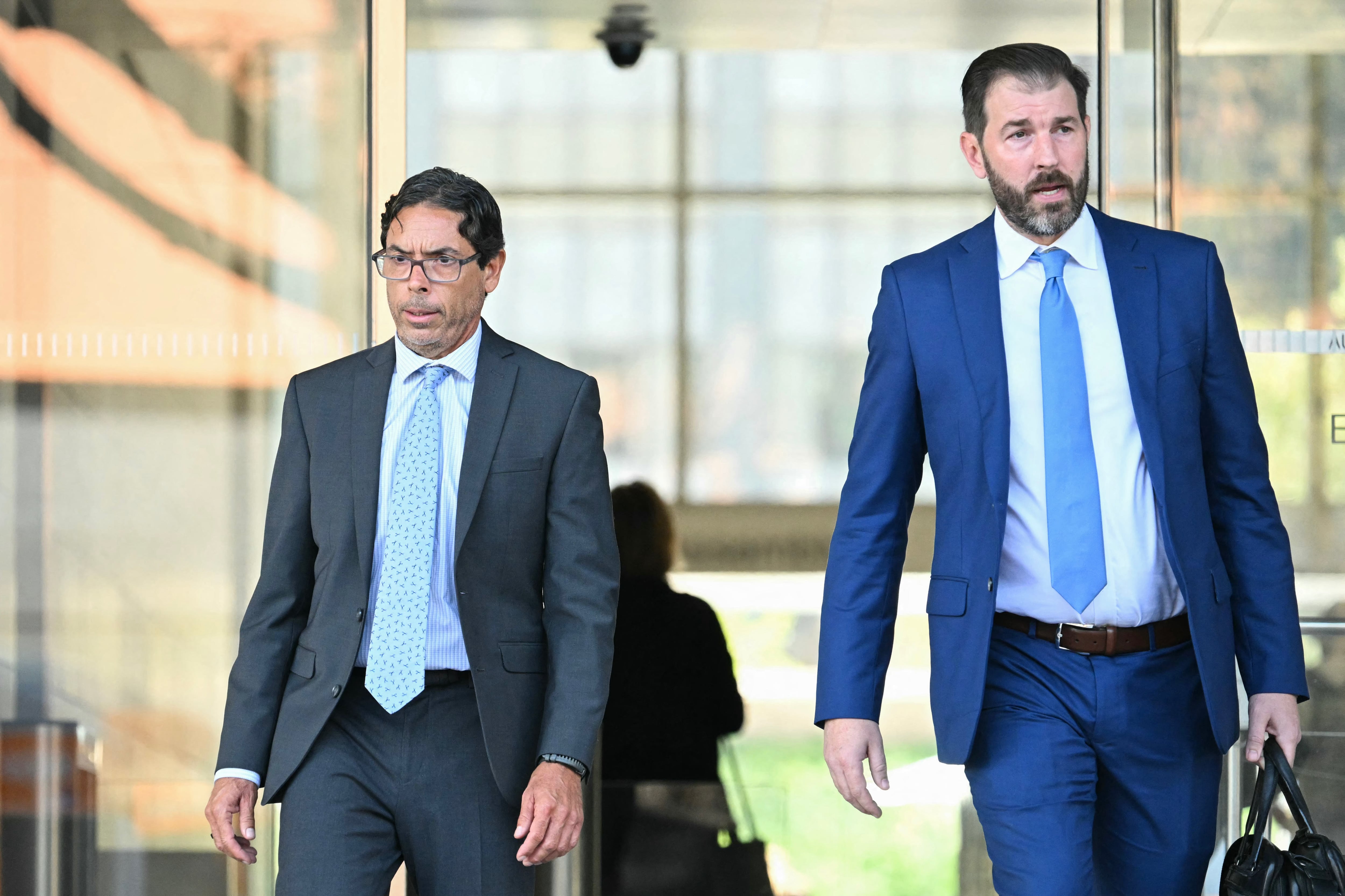 California physician Mark Chavez (L) and his attorney Matthew Binninger exit federal court in Los Angeles on October 2, 2024. Chavez pleaded guilty to conspiring to distribute the drug ketamine to the late actor Matthew Perry, who died of a ketamine overdose in October 2023. (Photo by Patrick T. Fallon / AFP)