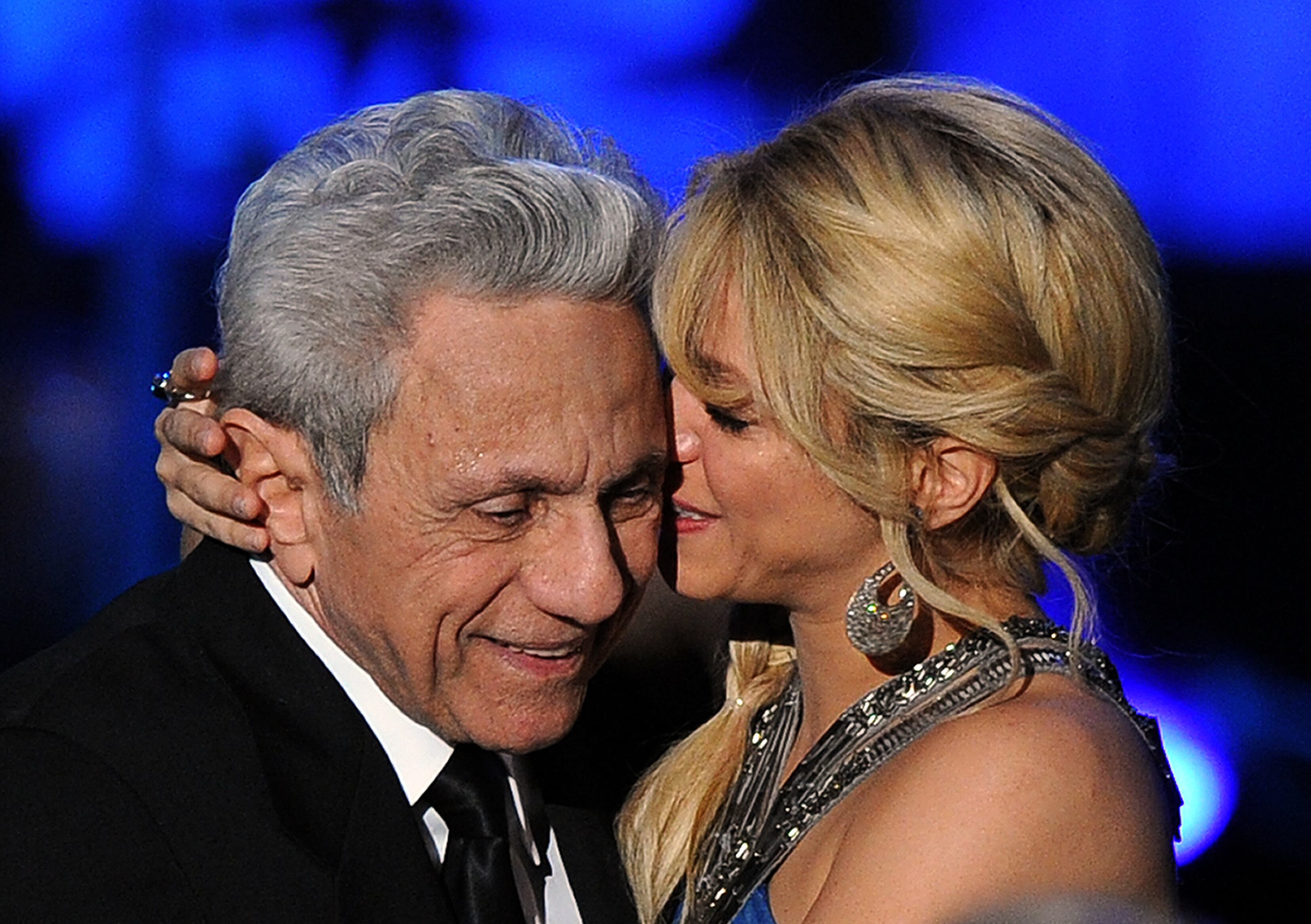 Colombian musician Shakira (R) embraces her father William Mebarak during the 2011 Latin Recording Academy's Person of the Year event on the sideline of the 12th annual Latin Grammy at Mandalay Bay Resort & Casino on November 9, 2011 in Las Vegas, Nevada. AFP Photo/Jewel Samad (Photo by JEWEL SAMAD / AFP)