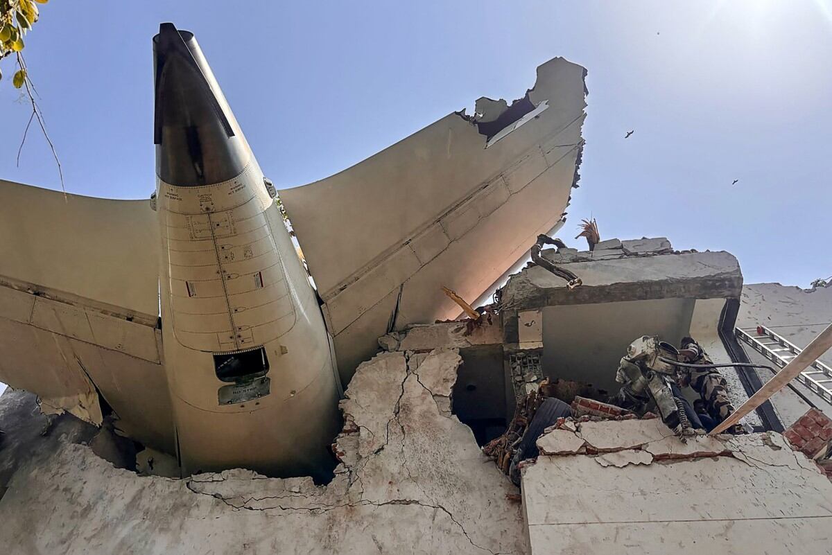 This handout taken and posted on the X (formerly Twitter) account of the Central Industrial Security Force (CISF) On June 12, 2025 shows the back of an Air India plane after it crashed in a residential area near the airport in Ahmedabad. The London-bound Air India flight 171 passenger plane crashed on June 12 in India's western city of Ahmedabad with 242 on board, aviation officials said in what the airline called a "tragic accident". (Photo by Handout / CENTRAL INDUSTRIAL SECURITY FORCE (CISF) / AFP) / -----EDITORS NOTE --- RESTRICTED TO EDITORIAL USE - MANDATORY CREDIT "AFP PHOTO / CENTRAL INDUSTRIAL SECURITY FORCE (CISF) " - NO MARKETING - NO ADVERTISING CAMPAIGNS - DISTRIBUTED AS A SERVICE TO CLIENTS