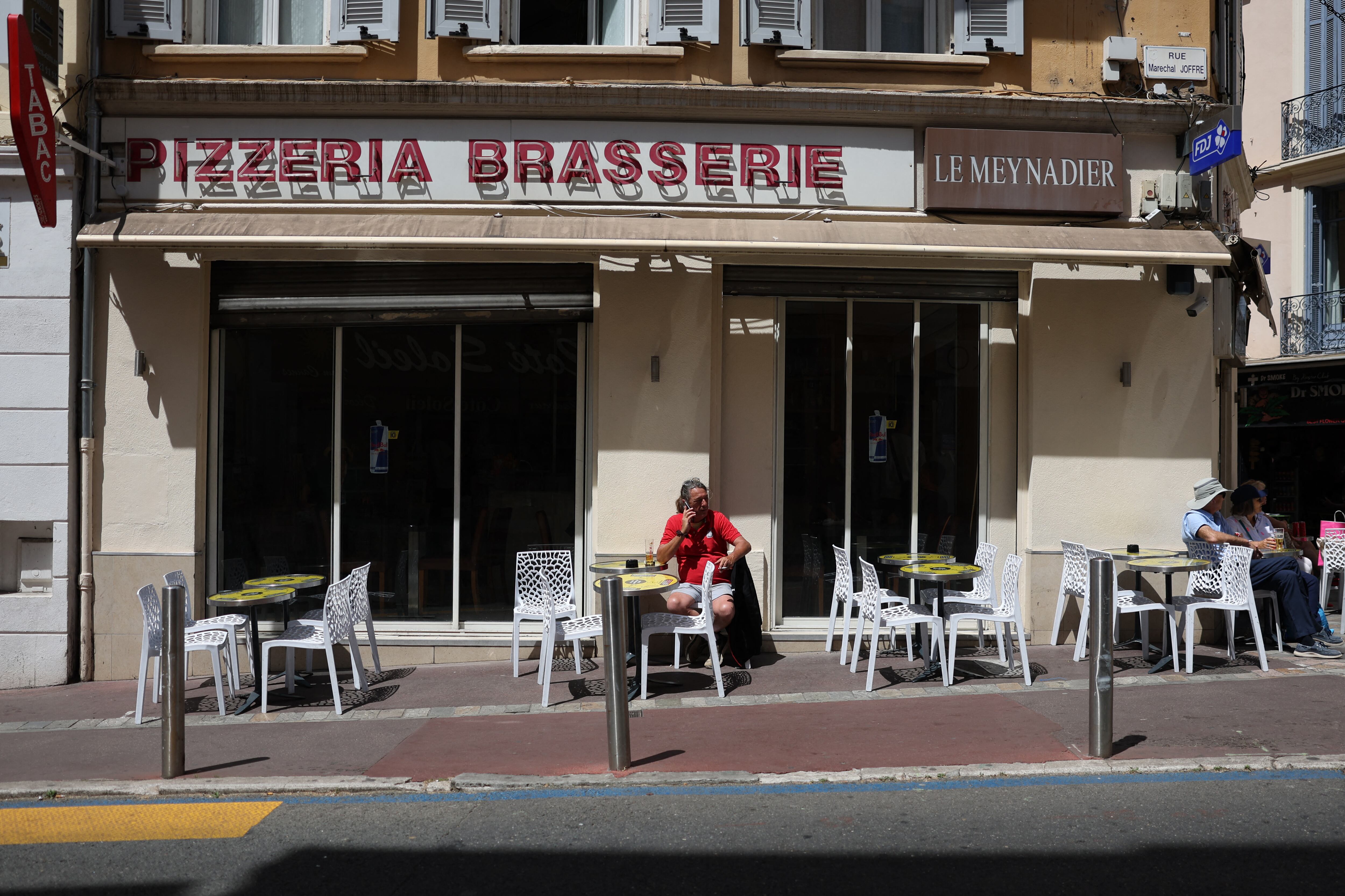 A lone man sits at empty restaurant terrasse as a power outage struck Southwestern France, on the final day of the 78th edition of the Cannes Film Festival in Cannes, southern France, on May 24, 2025. A major power outage hit the area around the French Rivera resort of Cannes on May 24, the final day of the city's film festival, though organisers said the closing ceremony would not be affected. The cause of the power cut, which began just after 10:00 am (0800 GMT), was a fire in a substation in the nearby village of Tanneron, probably an arson attack, police sources told AFP, asking not to be named.