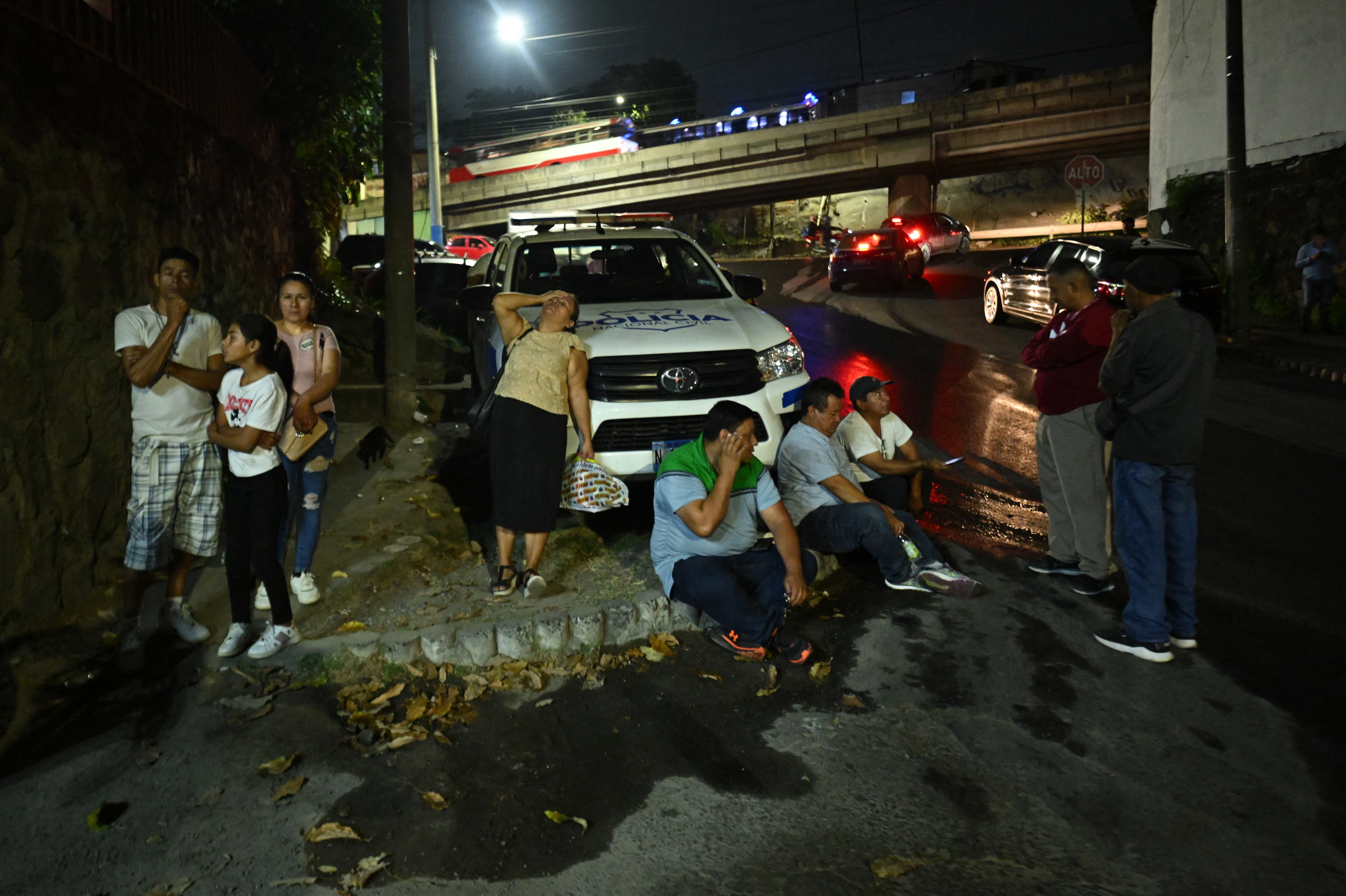 Relatives of Salvadoran migrants deported from the United States wait outside the Center for Attention to Returned Migrants in San Salvador on February 26, 2025. (Photo by Marvin RECINOS / AFP)