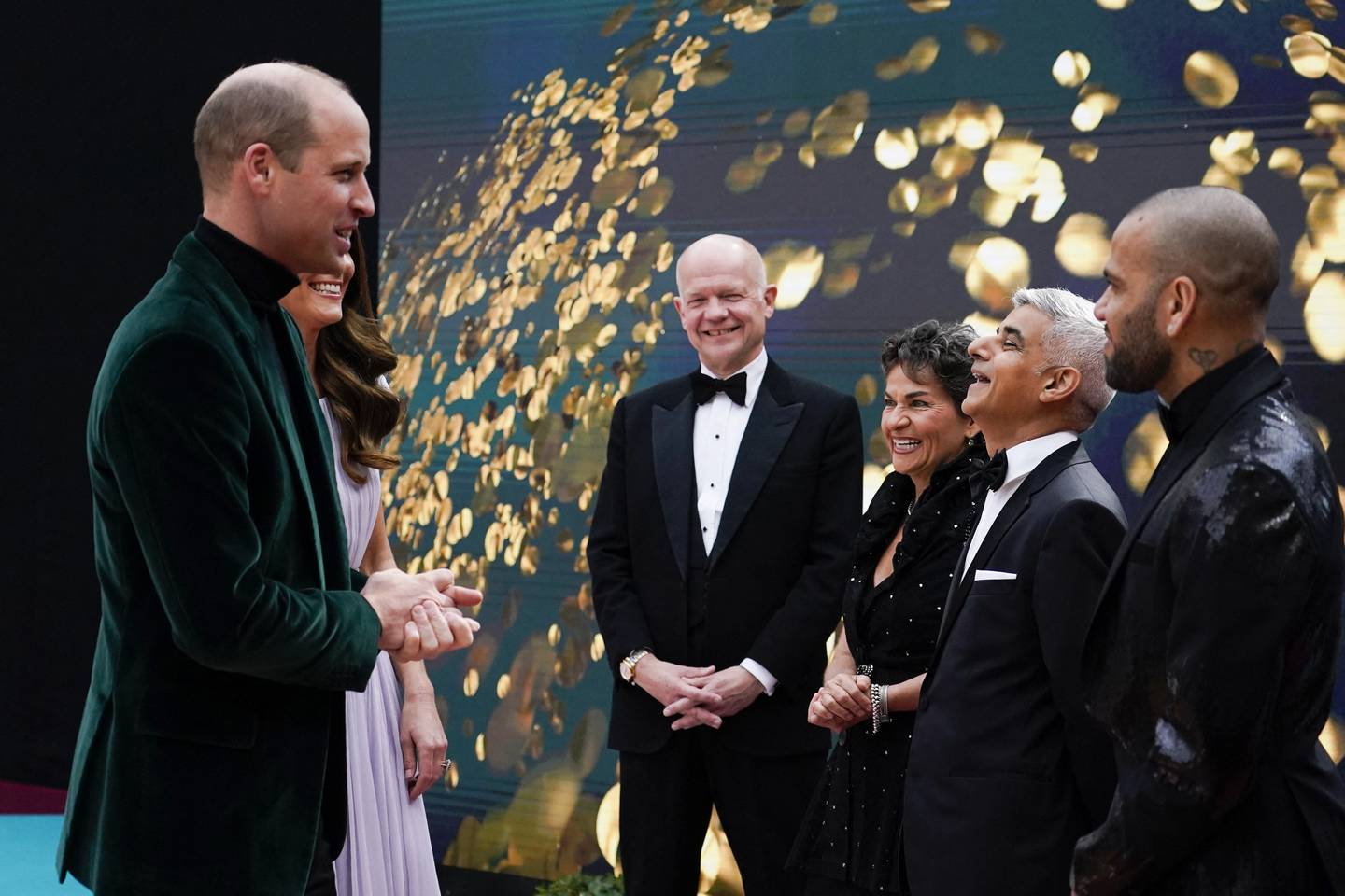 Britain's Prince William, Duke of Cambridge and Britain's Catherine, Duchess of Cambridge speak with guests as they attend the inaugural Earthshot Prize awards ceremony at Alexandra Palace in London on October 17, 2021. The Earthshot Prize honours five inaugural winners with an award of £1 million ($1.4 million, 1.2 million euros) each to pursue solutions to the world's greatest environmental problems at a glitering gala ceremony. Prince William, Duke of Cambridge, launched the prestigious Earthshot Prize in October 2020 and hopes that the event will help propel the fight against climate change leading up to the COP26 summit in Scotland, calling those on the shortlist "innovators, leaders and visionaries".
Alberto Pezzali / POOL / AFP